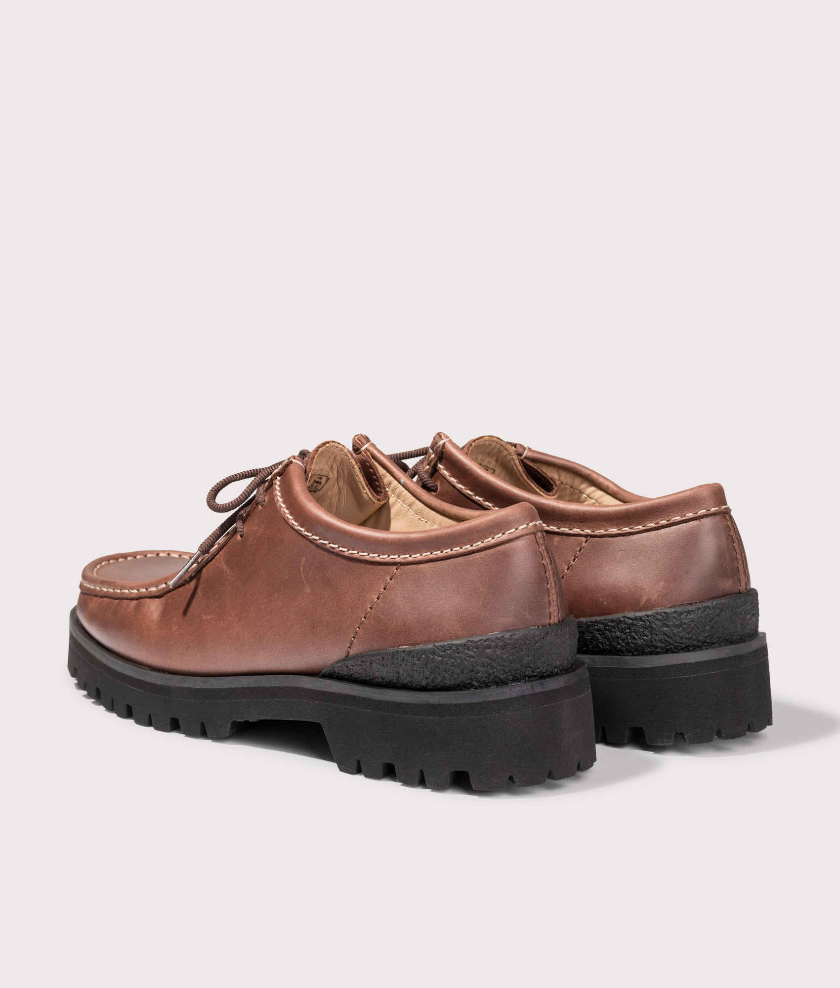 Clarks Originals Walla Yukoner Shoes in Brown Leather at EQVVS Menswear. Angled back shot.