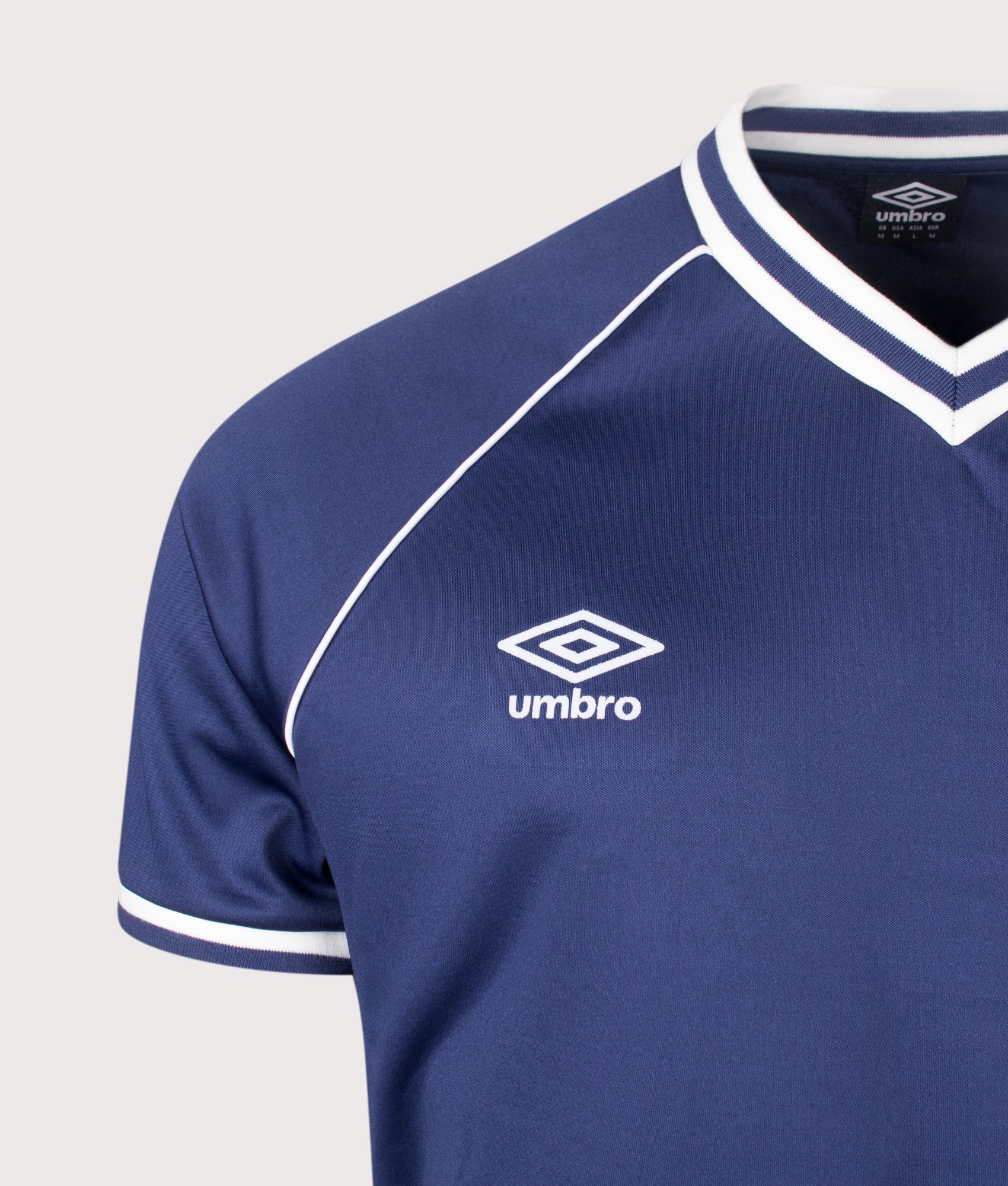 Umbro Jersey NR 8 in Patriot Blue at EQVVS Menswear. Detail shot.