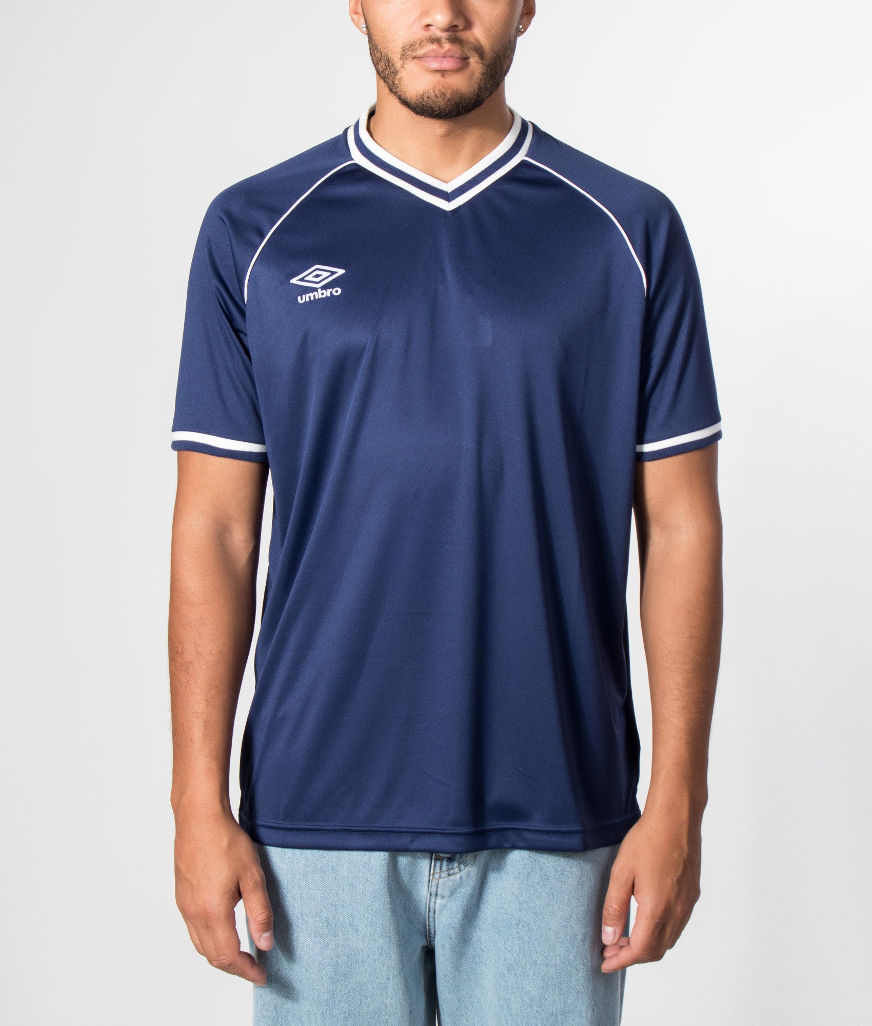 Umbro Jersey NR 8 in Patriot Blue at EQVVS Menswear. Model front shot.