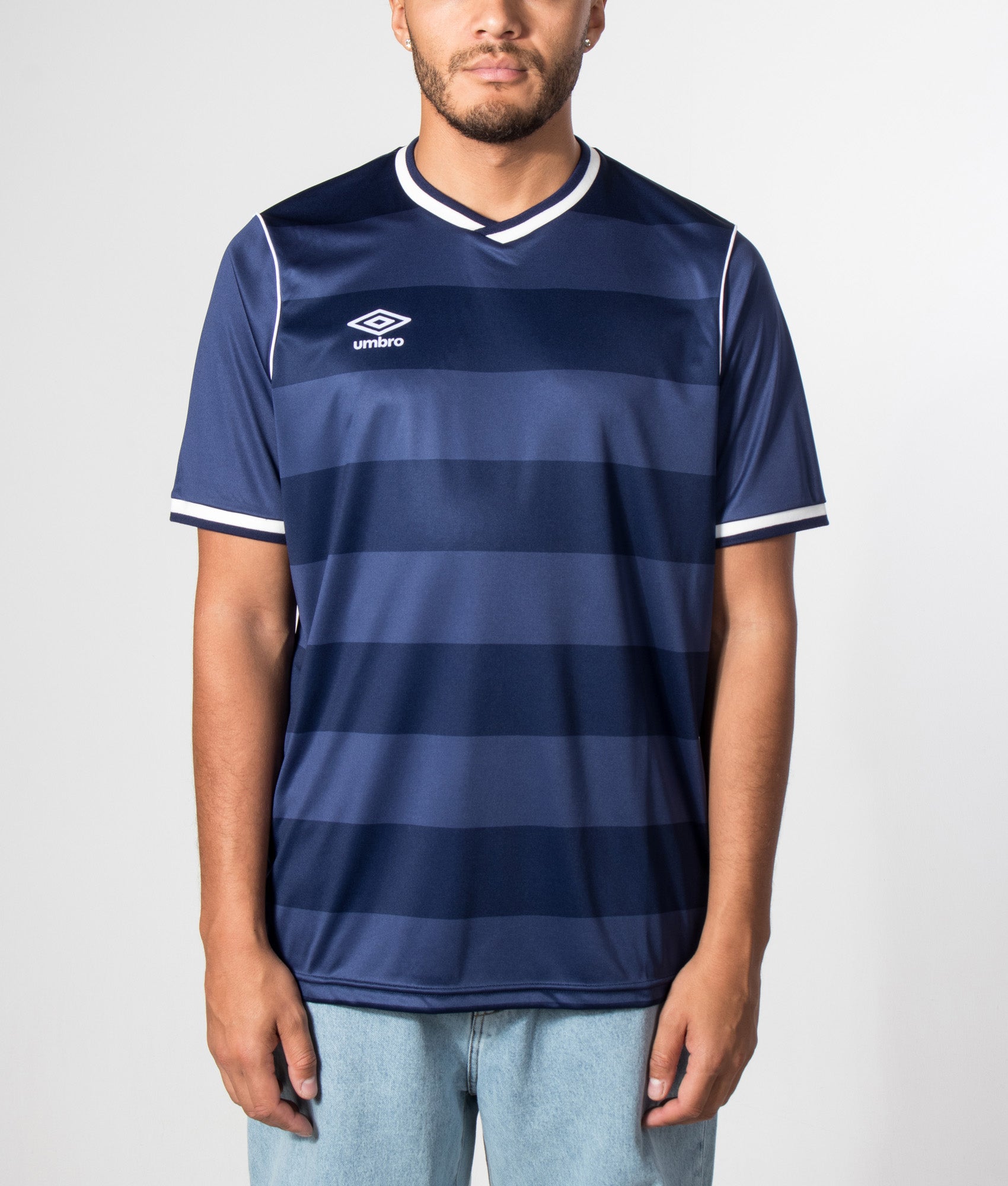 Umbro Jersey NR 7 in Patriot Blue at EQVVS Menswear. Model front shot.