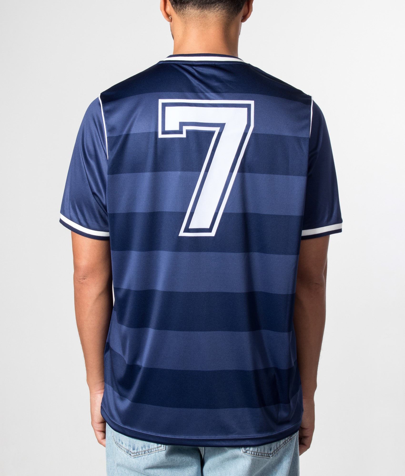 Umbro Jersey NR 7 in Patriot Blue at EQVVS Menswear. Model back shot.