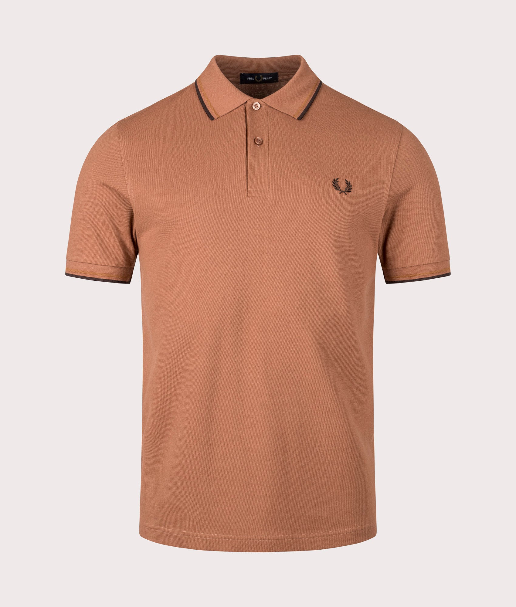 Twin Tipped Fred Perry Polo Shirt by Fred Perry in Cinnamon. Shot by EQVVS. Front shot.