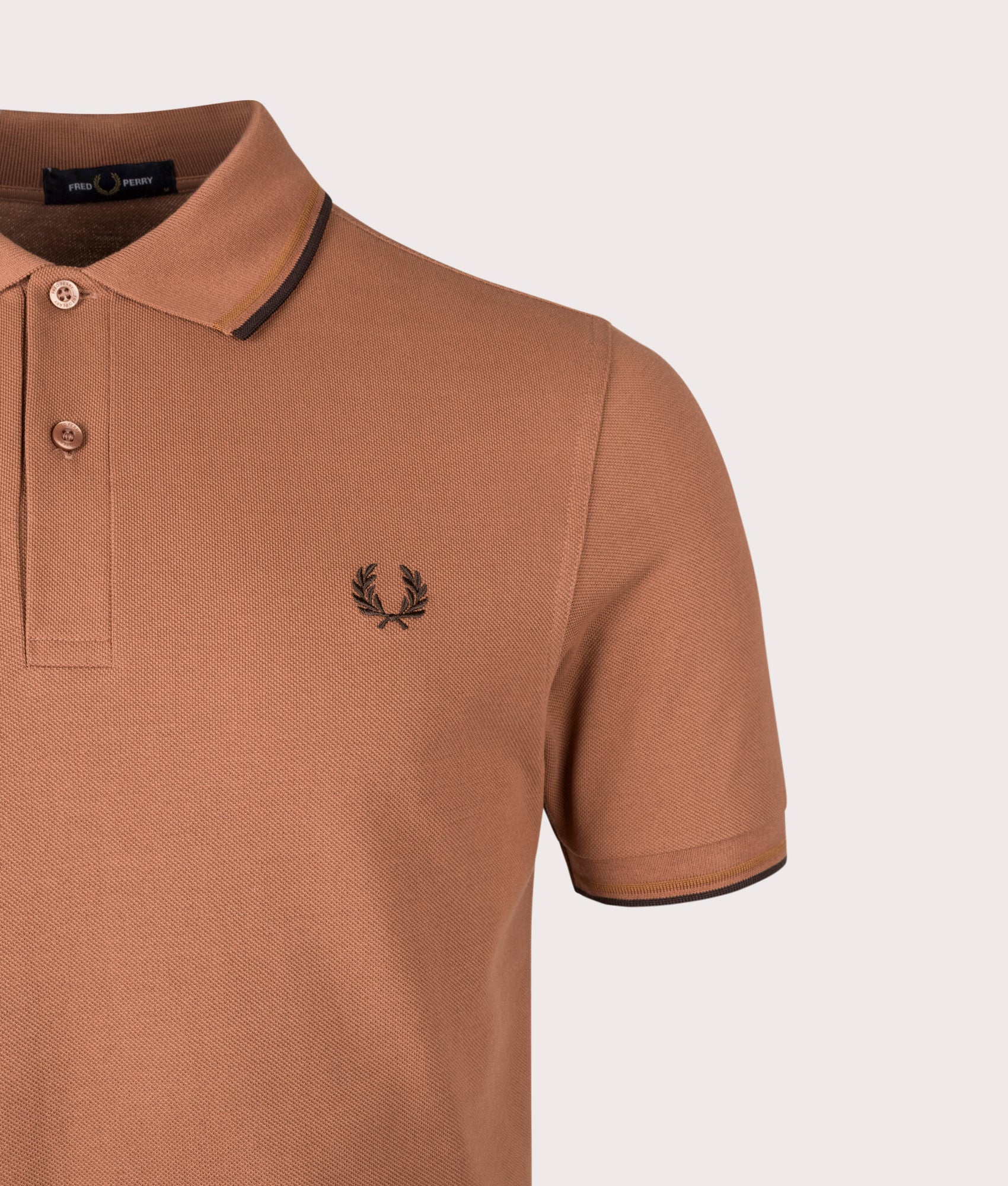 Twin Tipped Fred Perry Polo Shirt by Fred Perry in Cinnamon. Shot by EQVVS. Detail shot.