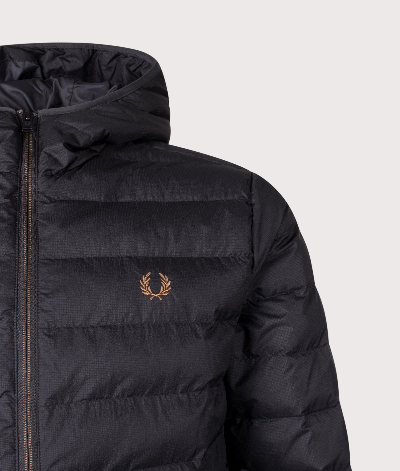 Fred Perry Hooded Insulated Jacket in Black at EQVVS Menswear. Details shot.