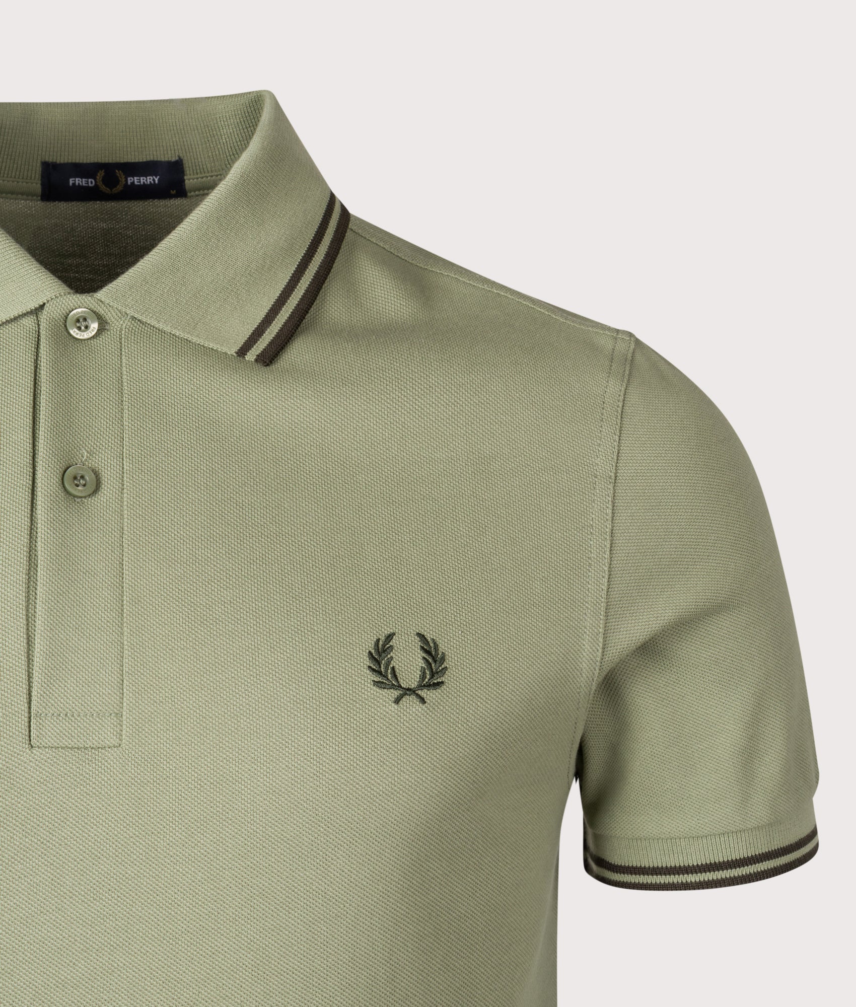 Twin Tipped Fred Perry Polo Shirt. Shot by EQVVS. Detail shot.