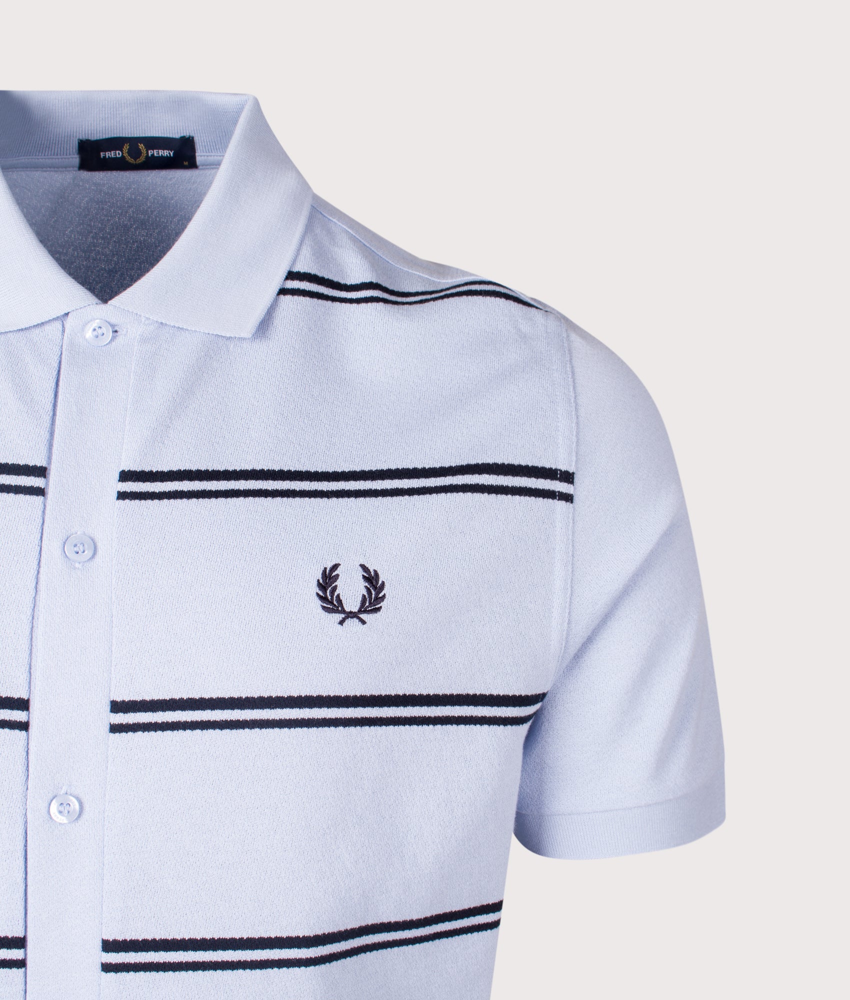 Striped Button Through Polo Shirt. Shot by EQVVS. Detail shot.