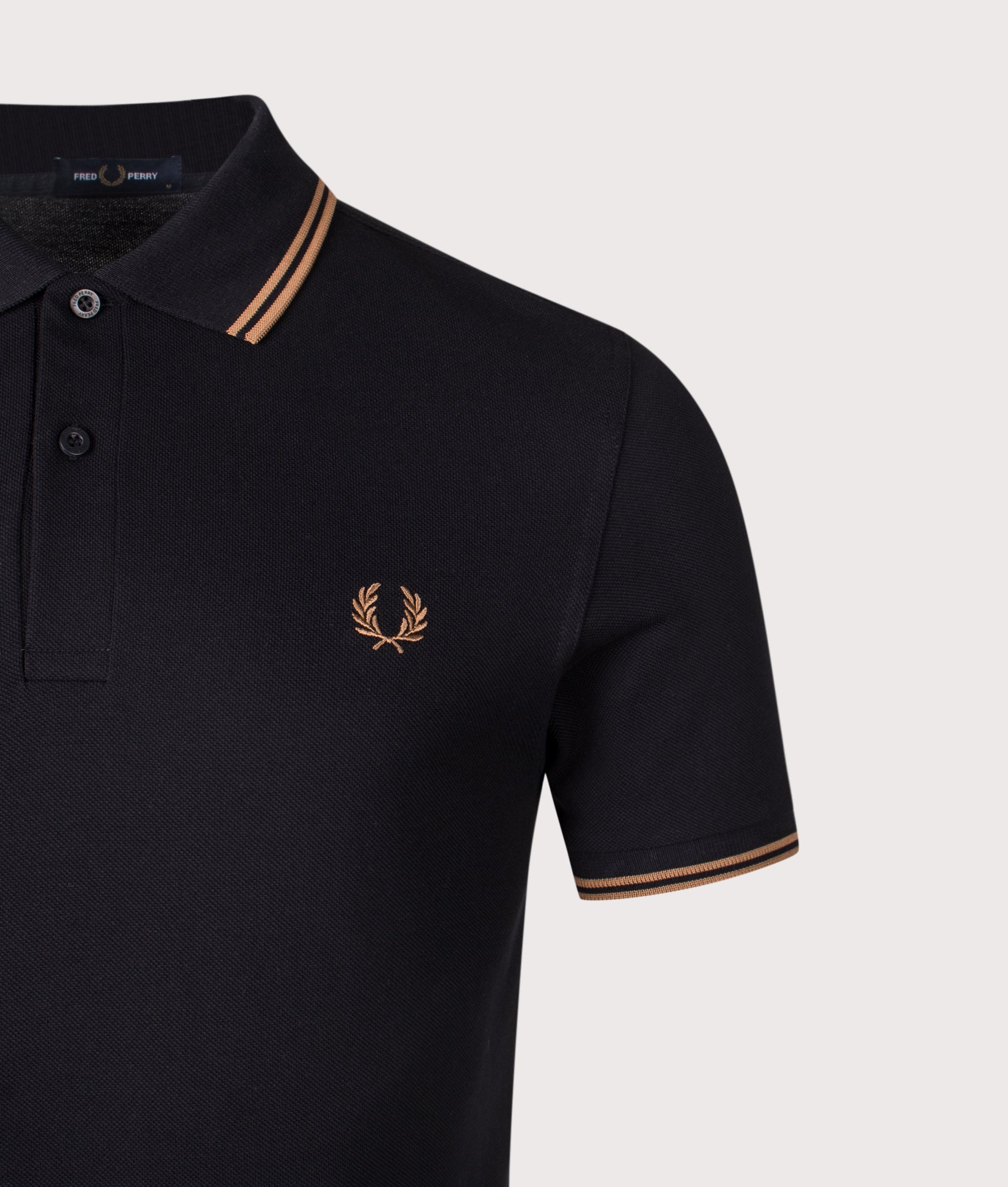 Twin Tipped Fred Perry Polo Shirt. Shot by EQVVS. Detail shot.