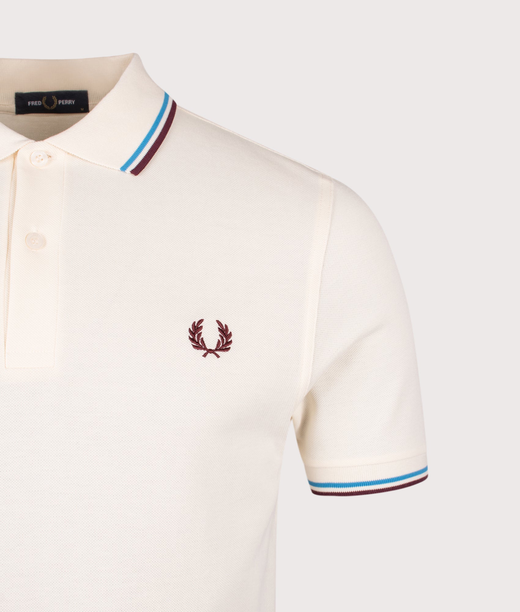Twin Tipped Fred Perry Polo Shirt. Shot by EQVVS. Detail shot.