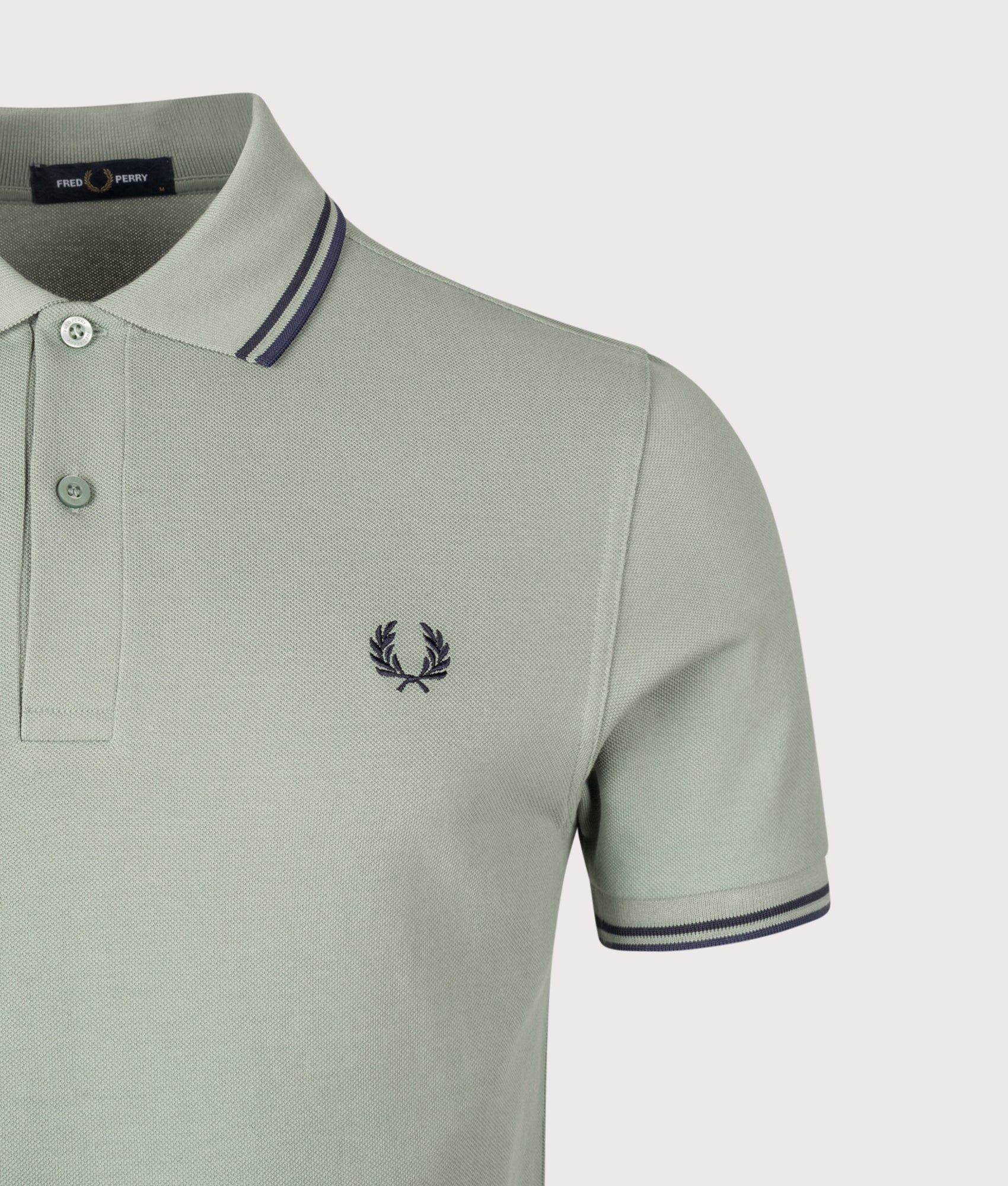 Twin Tipped Fred Perry Polo Shirt. Shot by EQVVS. Detail shot.
