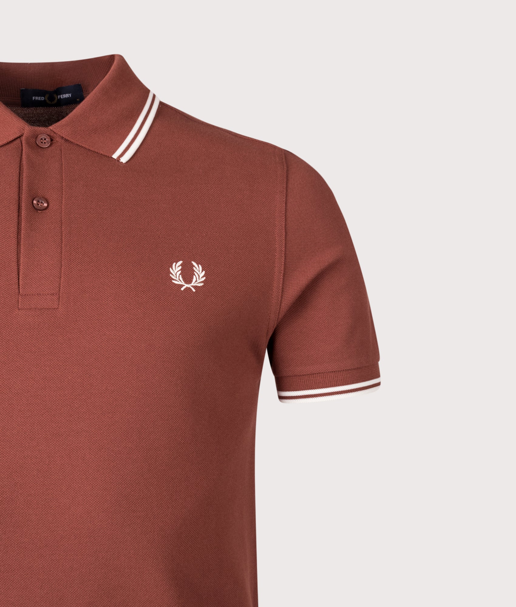 Twin Tipped Polo Shirt in Whiskey/Ecru | Fred Perry | Shot at EQVVS | Front detail shot 