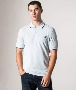 Fred Perry Twin Tipped Polo Shirt in Light Ice/Silky Peach/Tennis Blue at EQVVS Menswear. Model front shot.