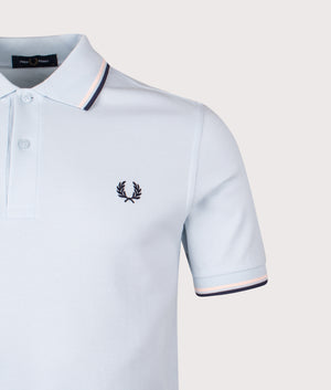 Twin Tipped Fred Perry Polo Shirt in Light Ice/Silky Peach/Tennis Blue | 100% Cotton | Shot at EQVVS | Front detail shot 