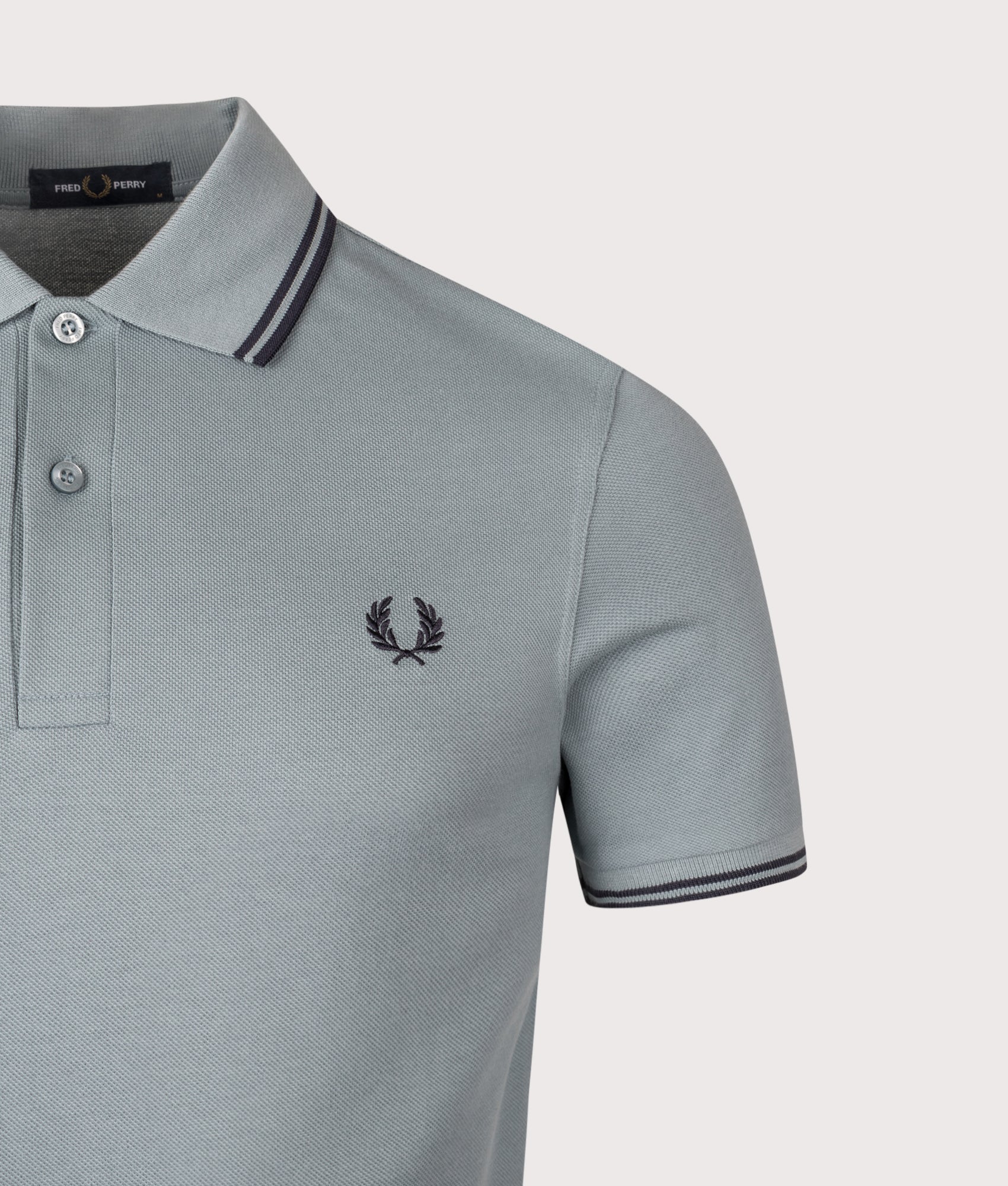 Twin Tipped Fred Perry Polo Shirt. Shot by EQVVS. Detail shot.