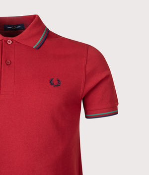 Twin Tipped Fred Perry Polo Shirt in Burnt Red/Sport Green/Navy | 100% Cotton | Shot at EQVVS | Front detail shot 