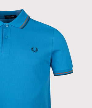 Twin Tipped Fred Perry Polo Shirt in Court Blue/Shaded Stone/Dark Petrol | 100% Cotton | Shot at EQVVS | Front detail shot 