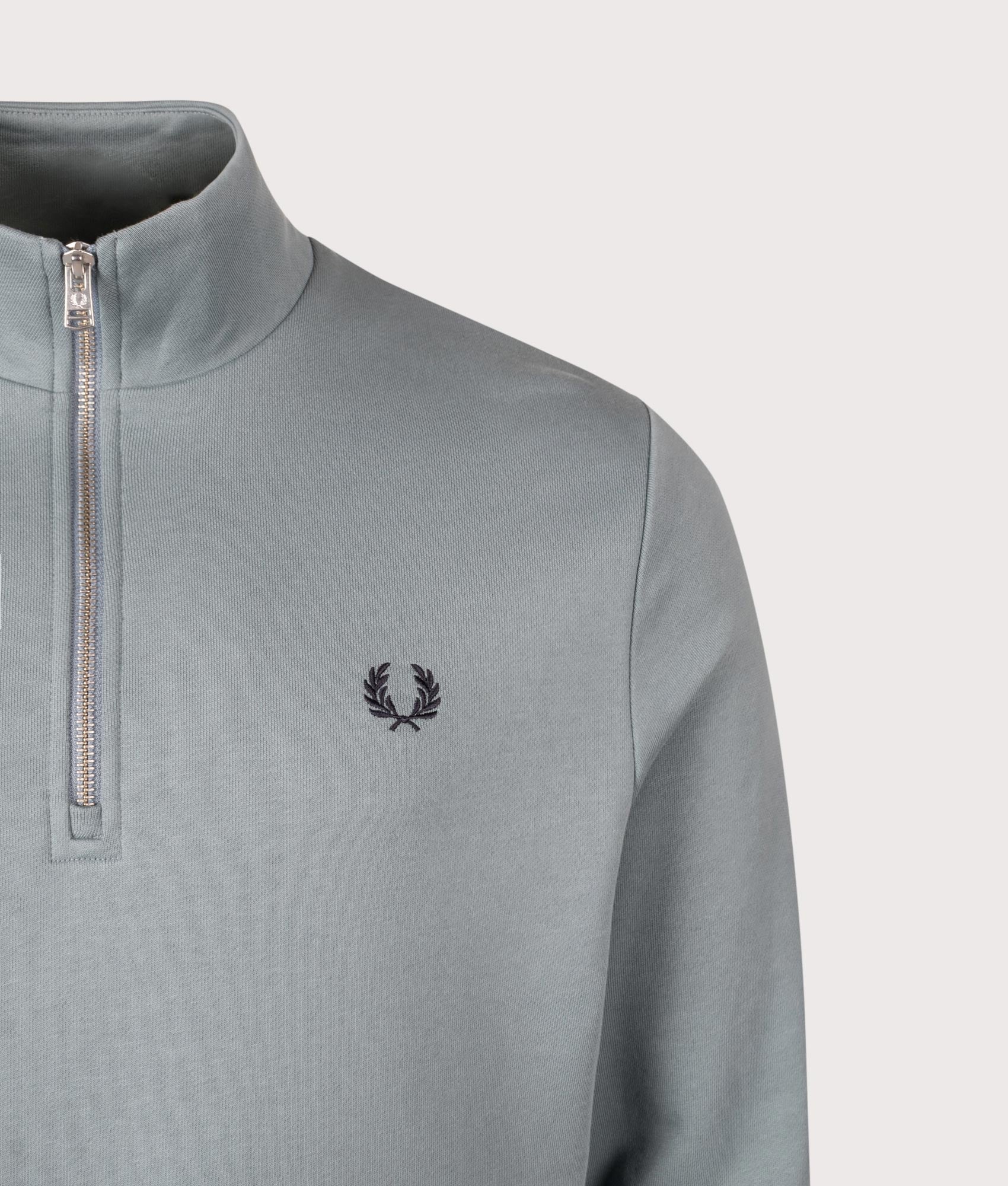 Fred Perry Quarter Zip Sweatshirt in Stockport Blue and Navy at EQVVS Menswear. Detail shot.