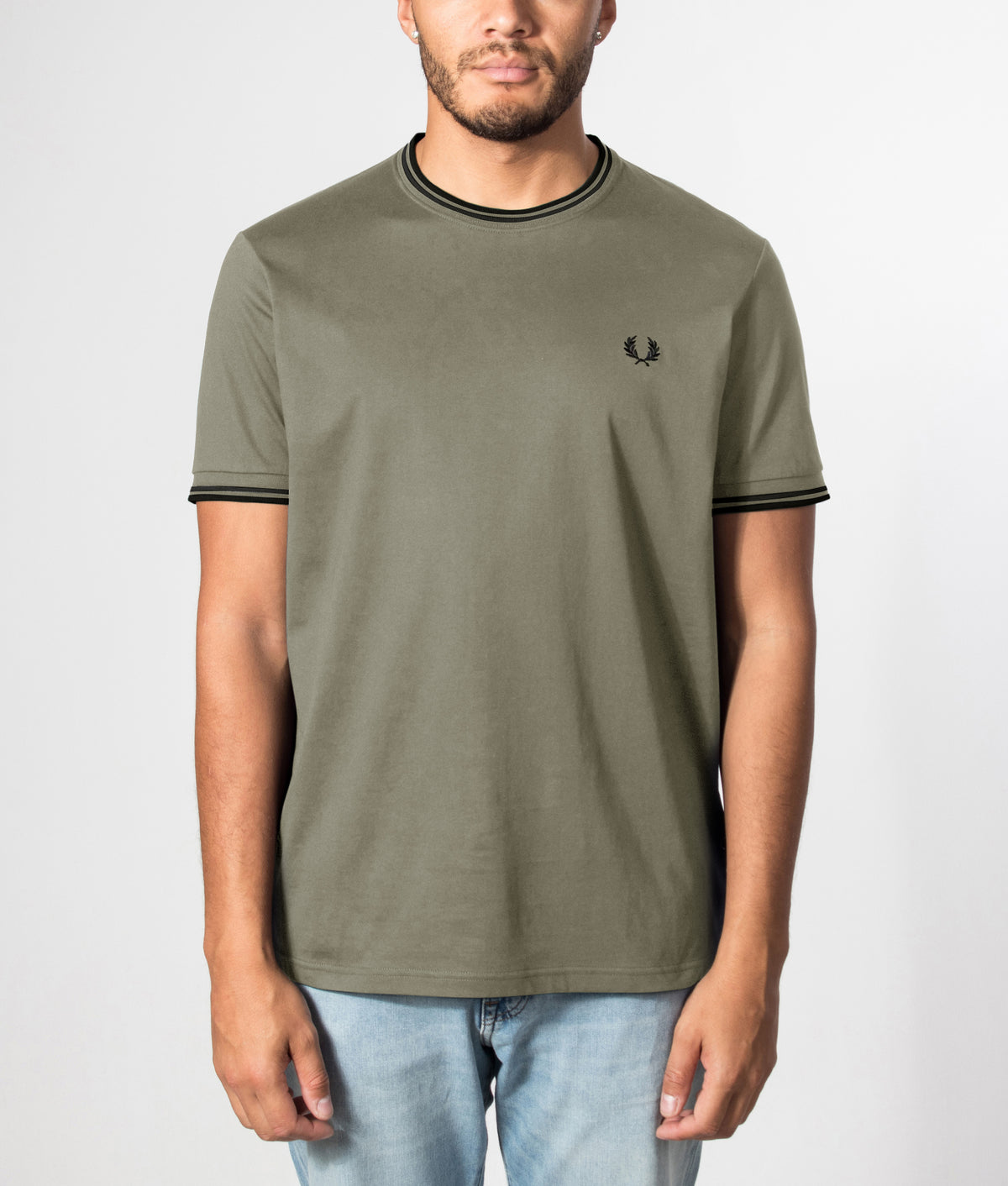 Fred Perry Twin Tipped T-Shirt in Laurel Wreath Green and Black at EQVVS Menswear. Front model shot.