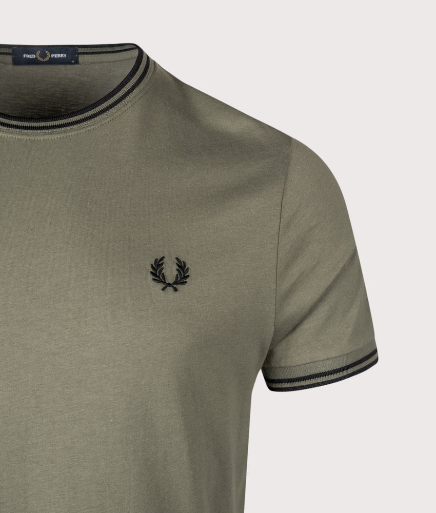Fred Perry Twin Tipped T-Shirt in Laurel Wreath Green and Black at EQVVS Menswear. Detail shot.