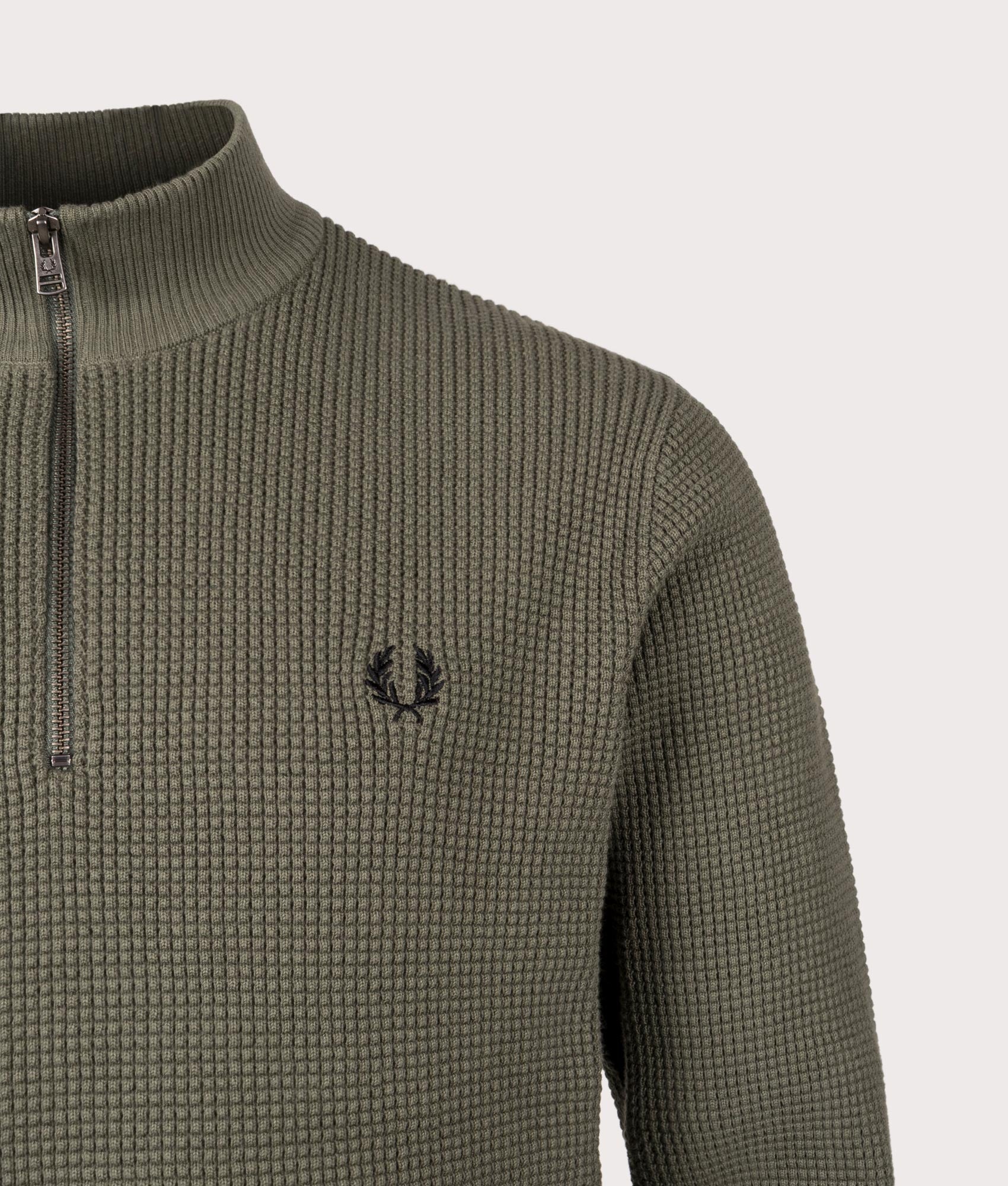 Waffle Stitch Quarter Zip Jumper by Fred Perry in Laurel Wreath Green. Shot by EQVVS. Detail shot.
