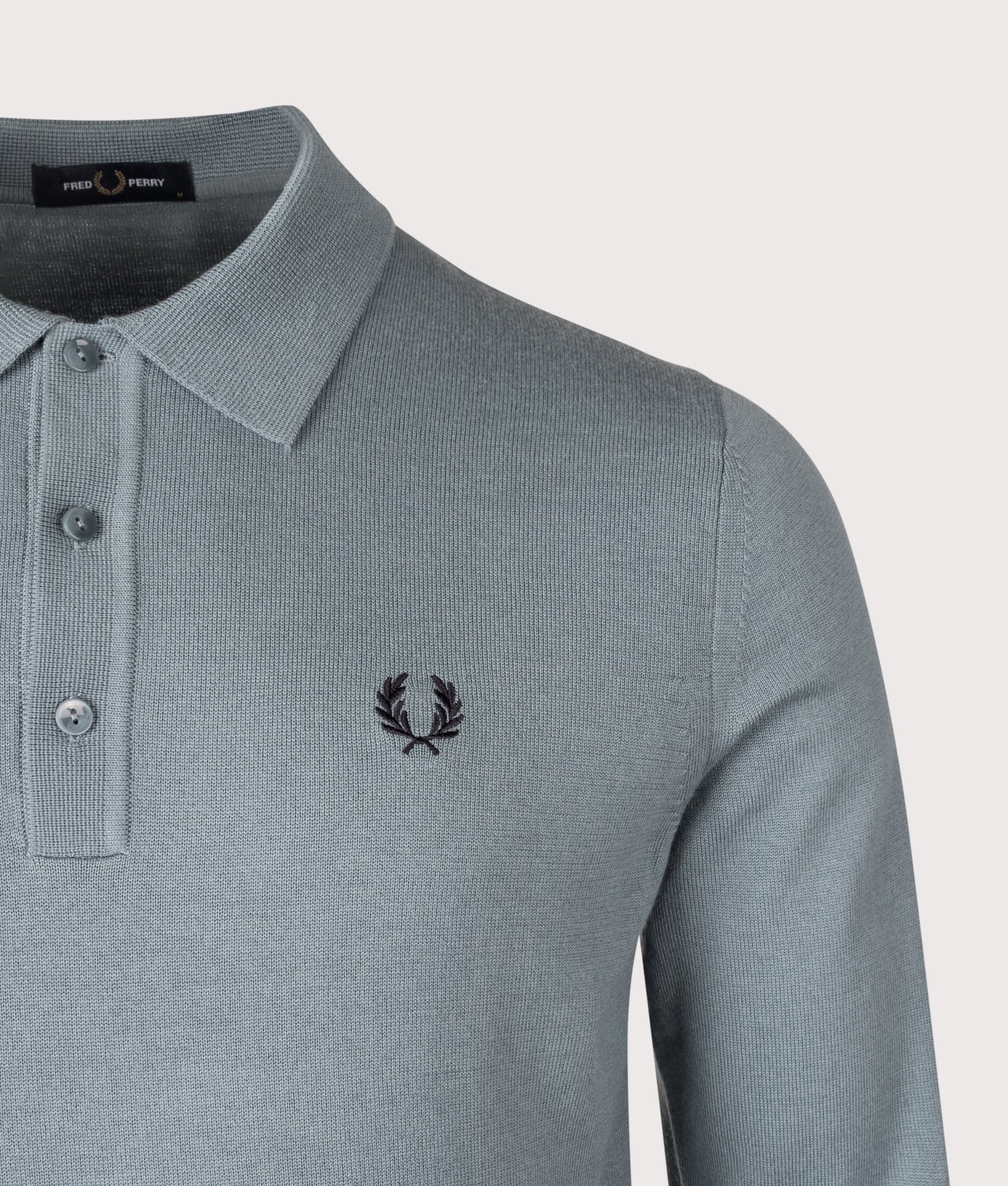 Long Sleeve Knitted Polo Shirt in Stockport Blue | Wool and cotton blend | Fred Perry | EQVVS | Front detail shot 