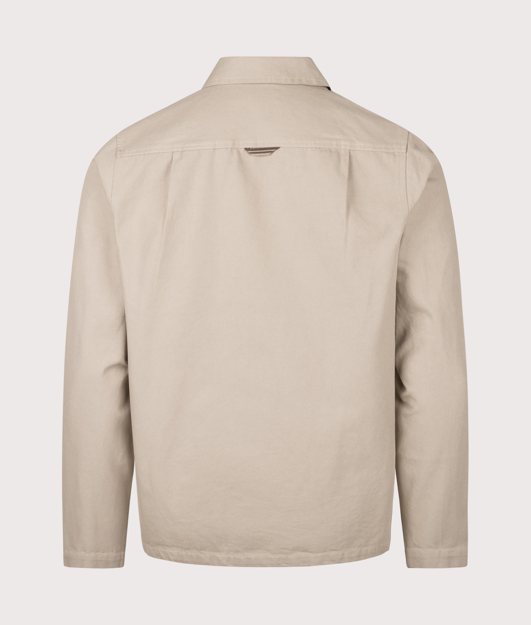 Fred Perry Canvas Overshirt in Warm Oat at EQVVS Menswear. Back shot.