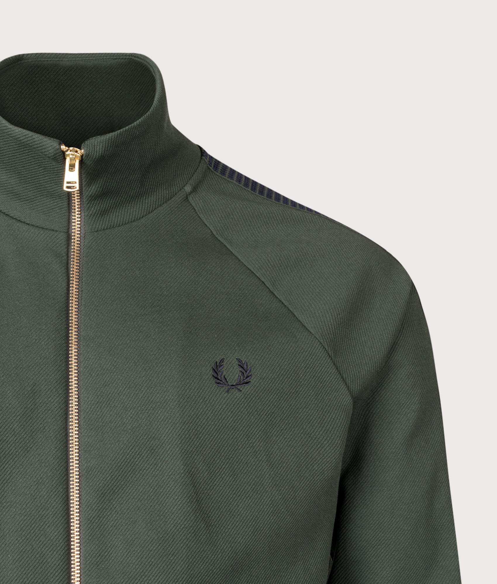 Fred Perry Dash Taped Track Jacket in Court Green at EQVVS Menswear. Detail shot.