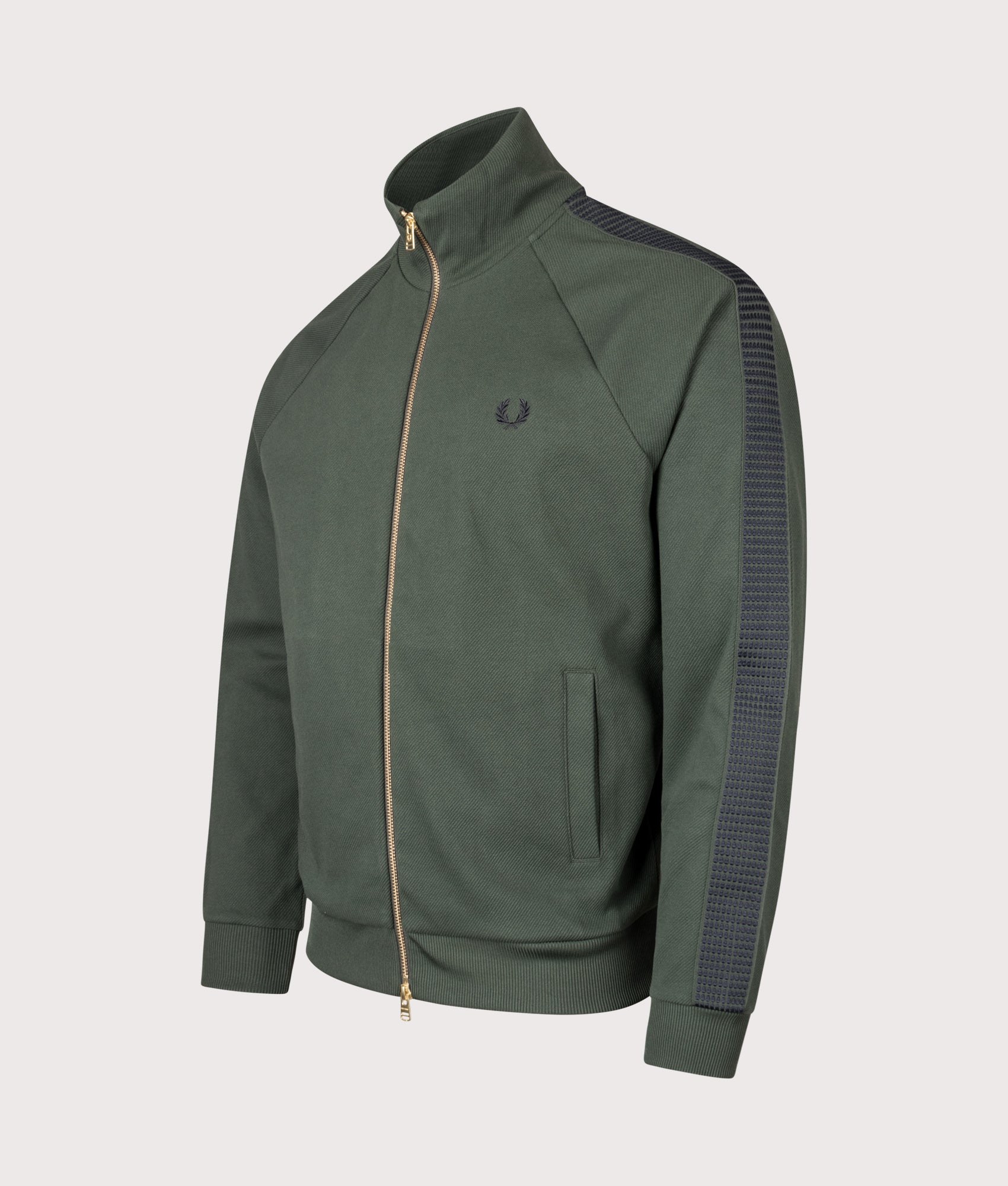 Fred Perry Dash Taped Track Jacket in Court Green at EQVVS Menswear. Angled front shot.