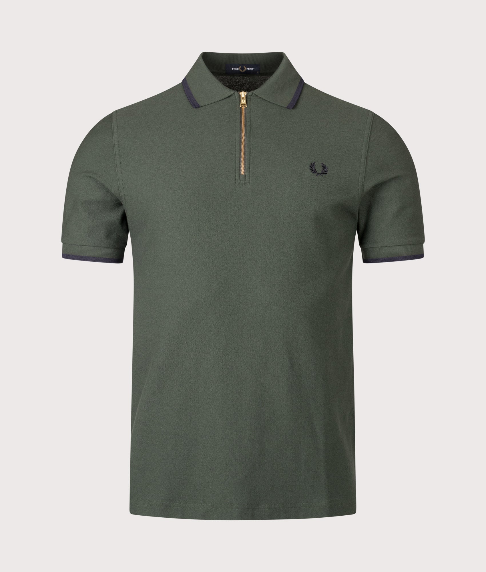 Fred Perry Crepe Piqué Polo Shirt in Court Green at EQVVS Menswear. Front shot.