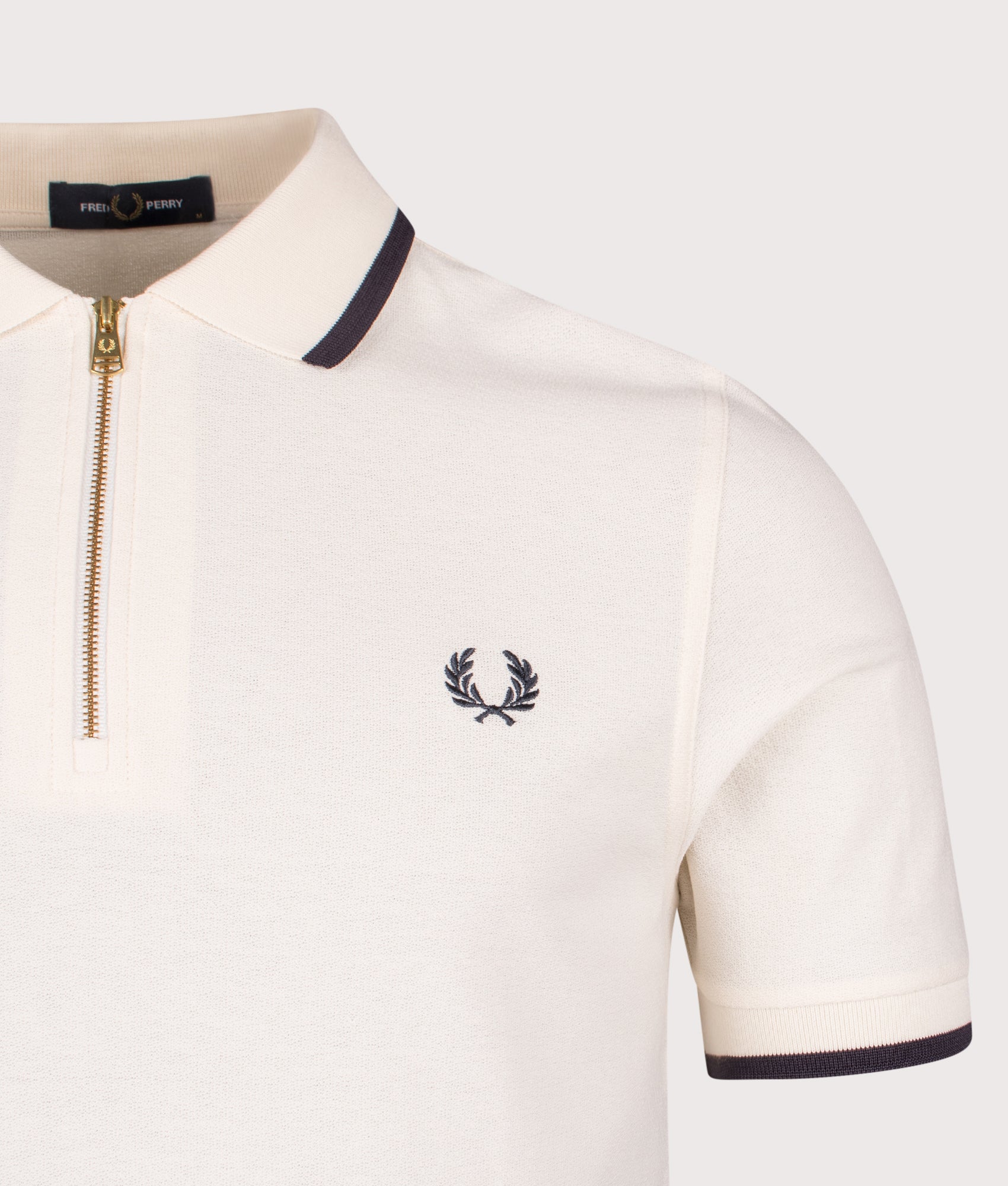 Fred Perry Crepe Piqué Polo Shirt in Ecru at EQVVS Menswear. Detail shot.