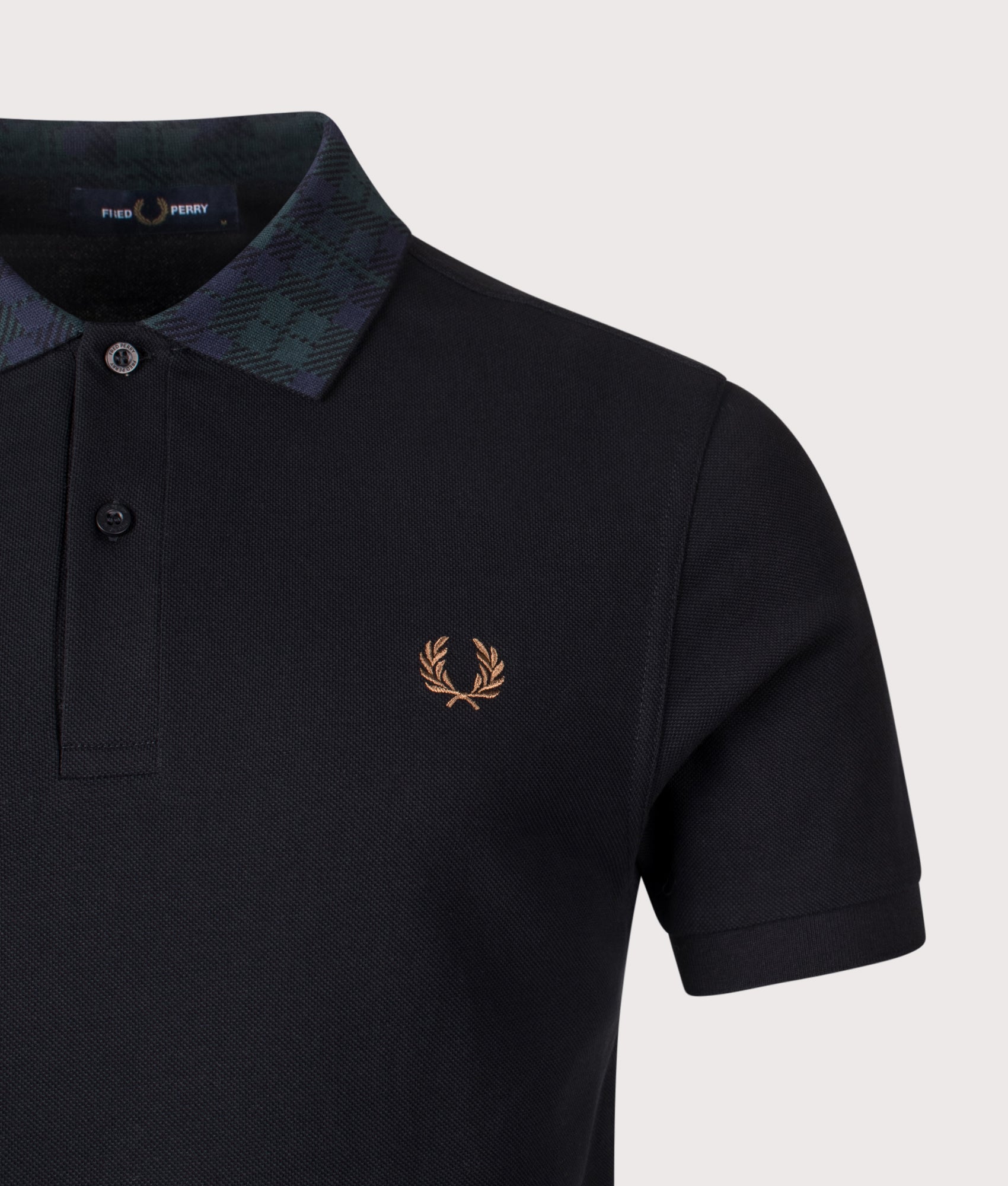 Fred Perry Blackwatch Tartan Collar Polo Shirt in Black at EQVVS Menswear. Detail shot.