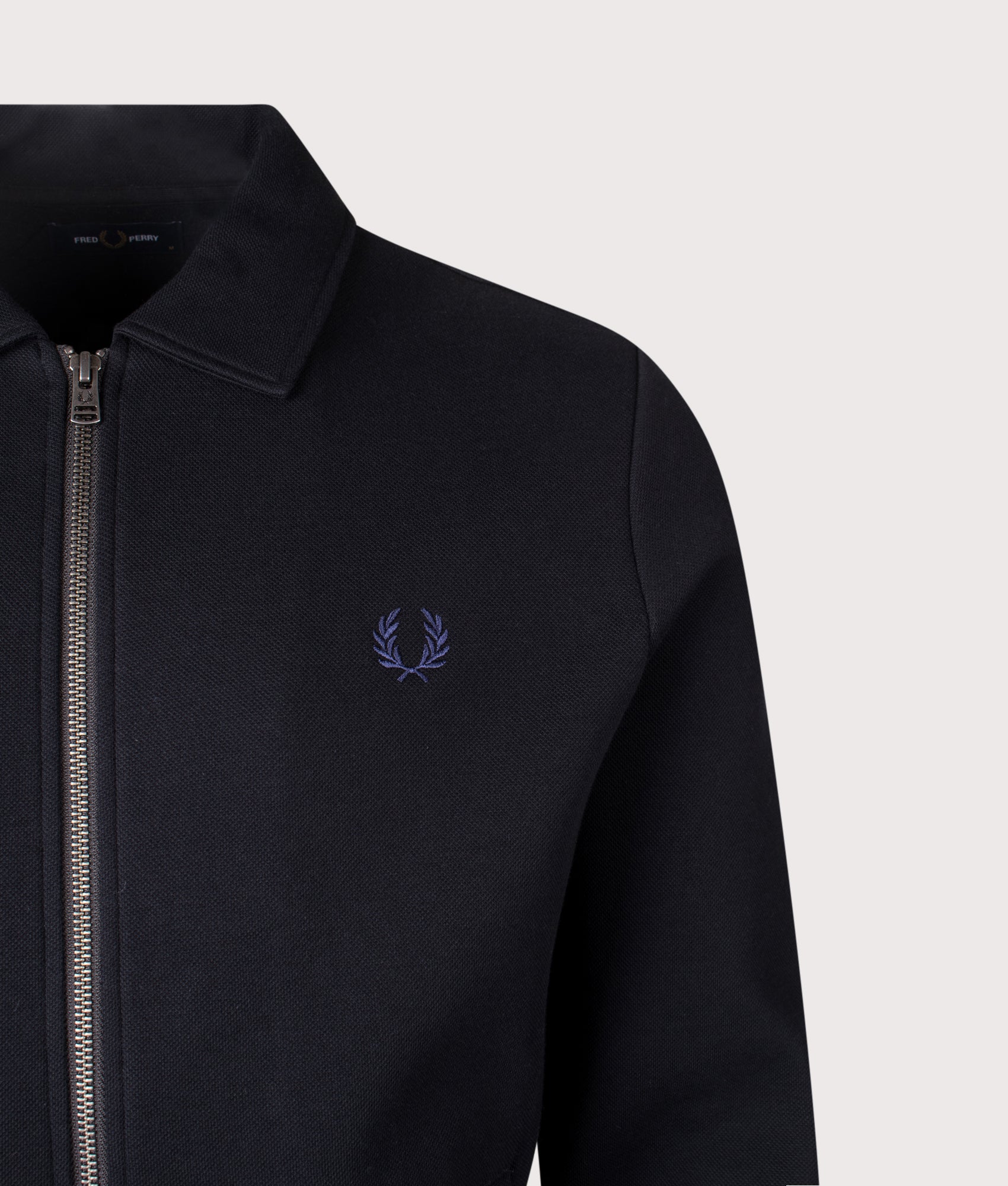 Fred Perry Zip Through Collared Sweatshirt in black at EQVVS Menswear. Detail shot.