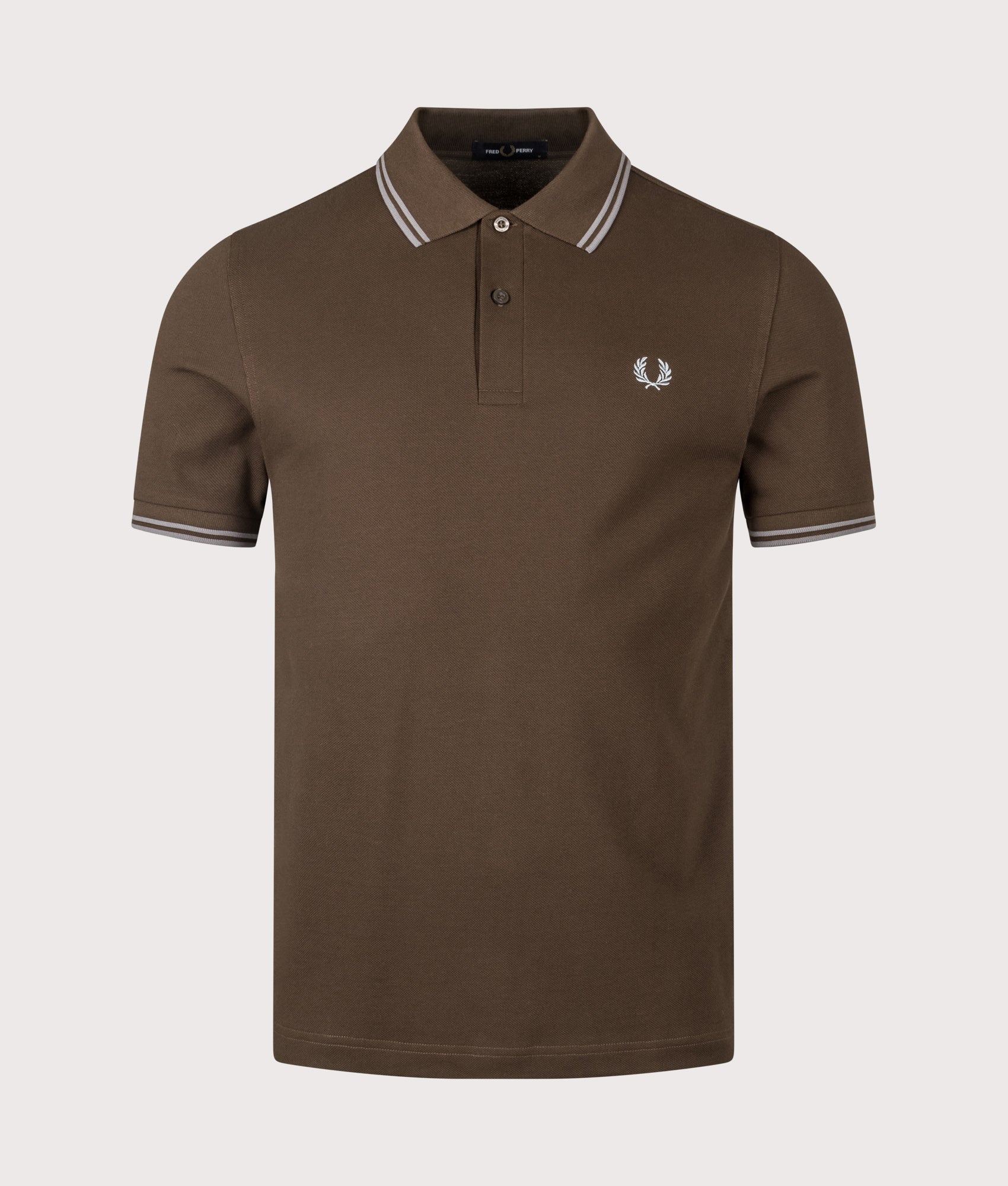 Fred Perry Twin Tipped  Polo Shirt arrives in the Burnt Tobacco and Stockport Blue at EQVVS Menswear. Front shot.