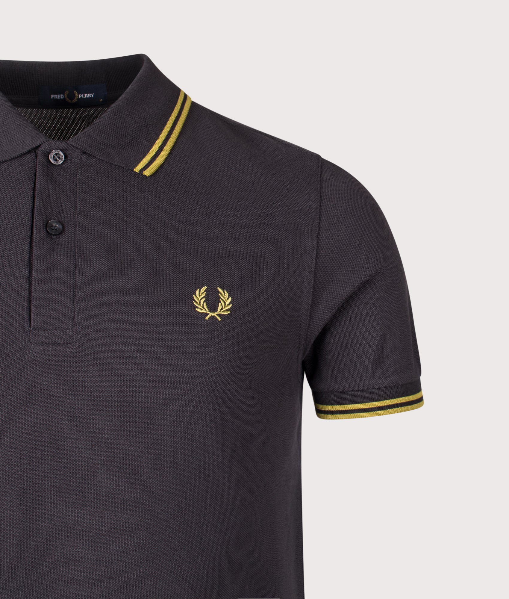 Fred Perry Twin Tipped Polo Shirt in Anchor Grey and Tennis Ball Yellow at EQVVS Menswear. Detail shot.
