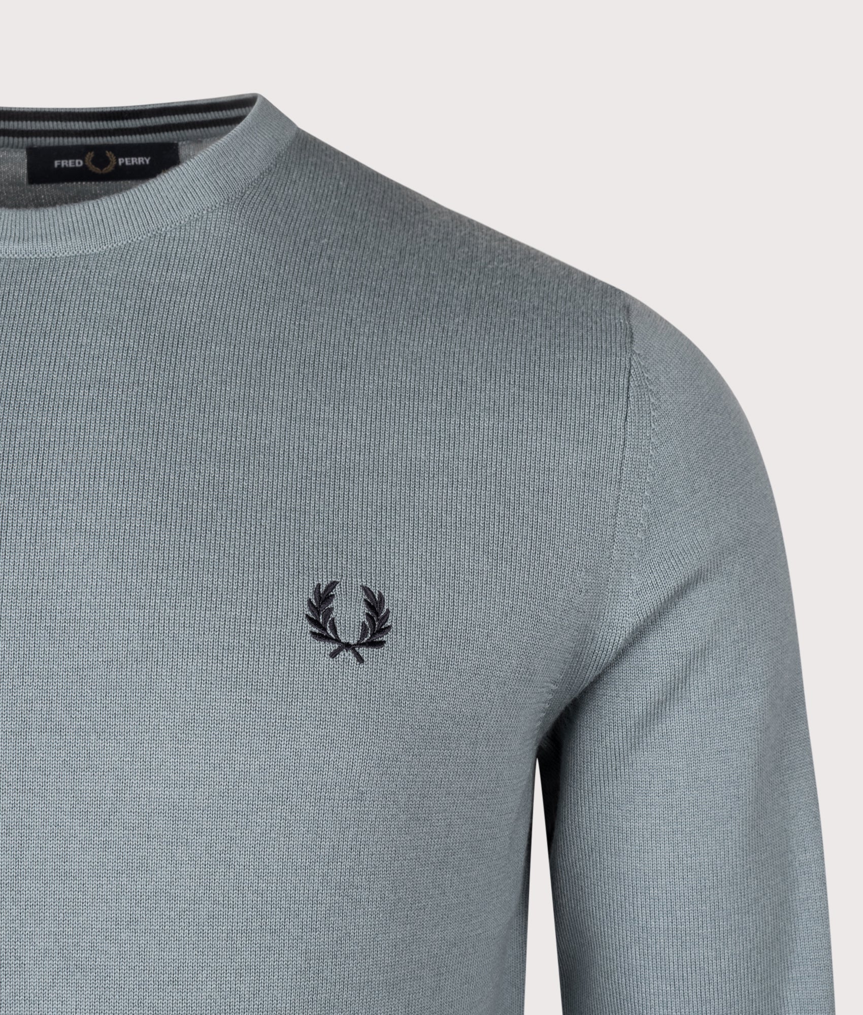 Fred Perry Classic Crew Neck Jumper in Stockport Blue at EQVVS Menswear. Detail shot.