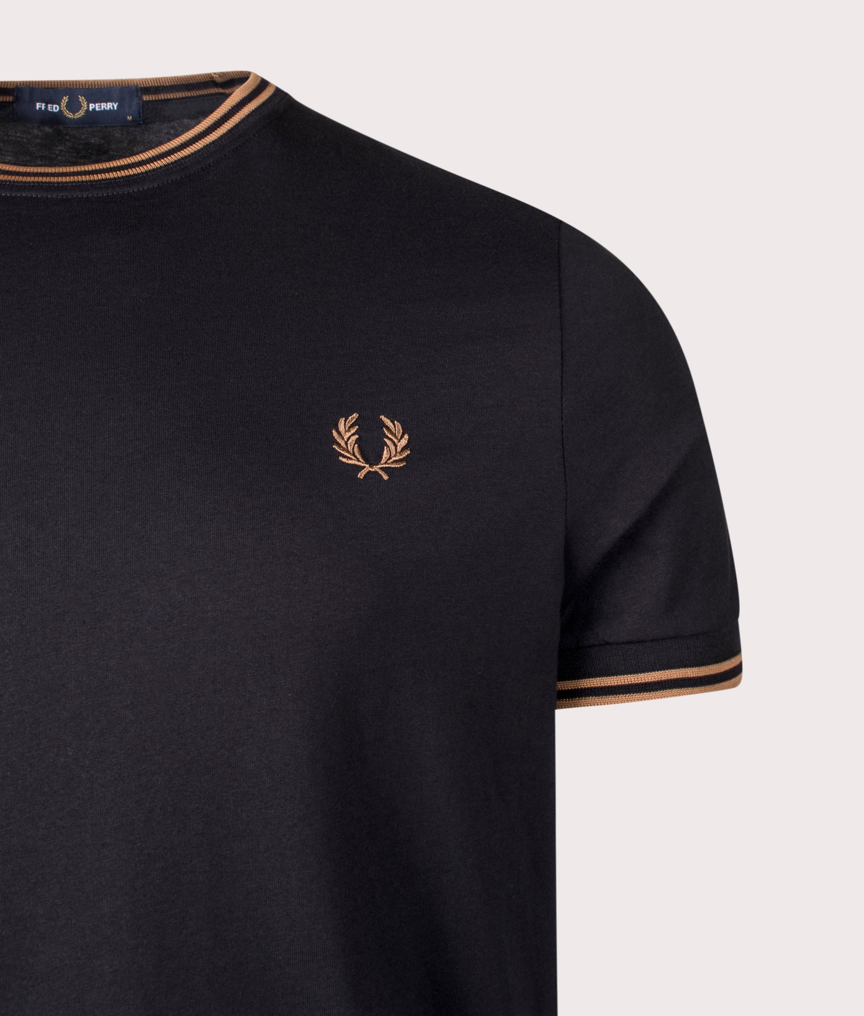 Twin Tipped T-Shirt by Fred Perry in Black. Shot by EQVVS. Detail shot.