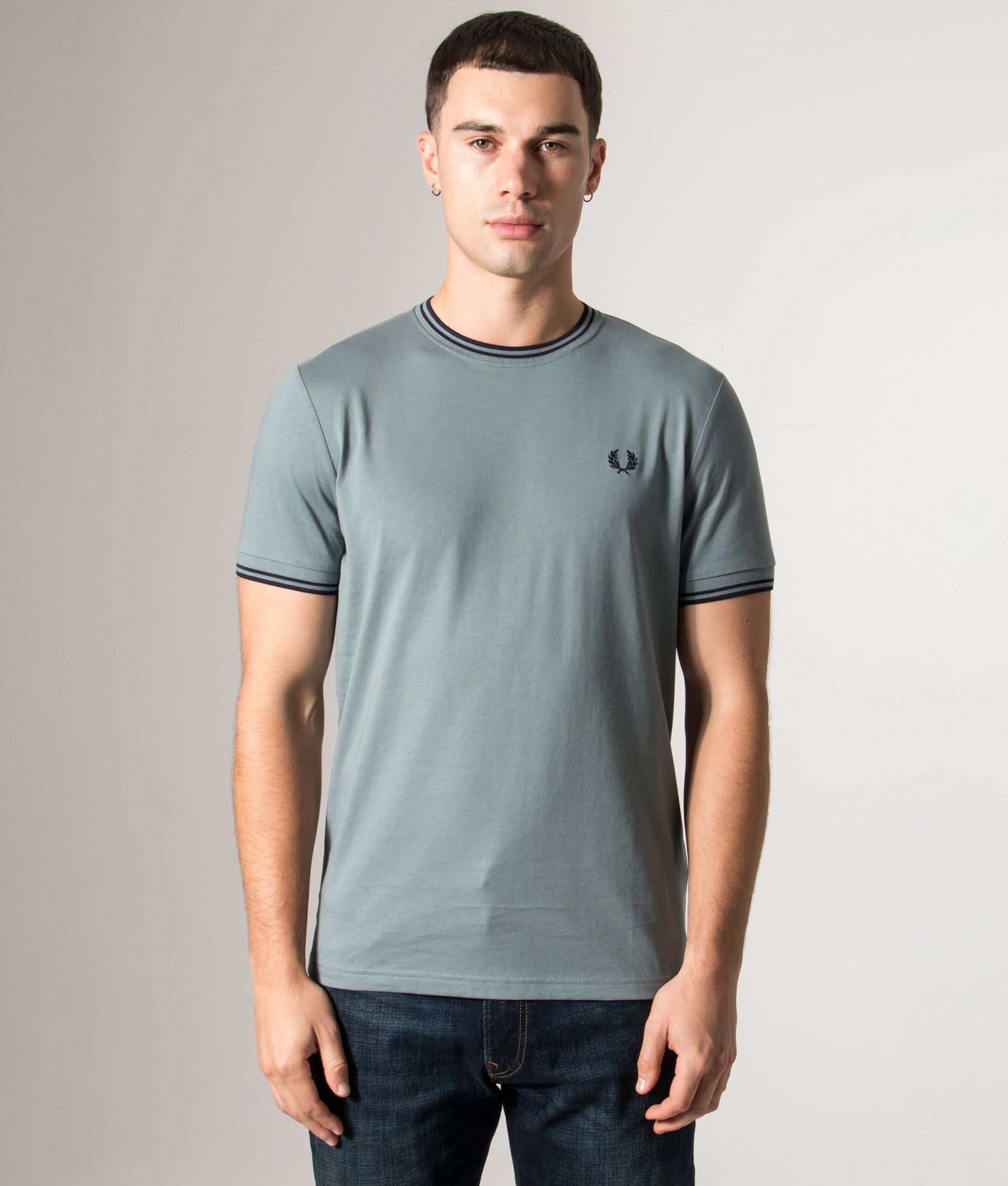 Fred Perry Twin Tipped T-Shirt in Stockport Blue/Navy/Navy at EQVVS Menswear. Model front shot.