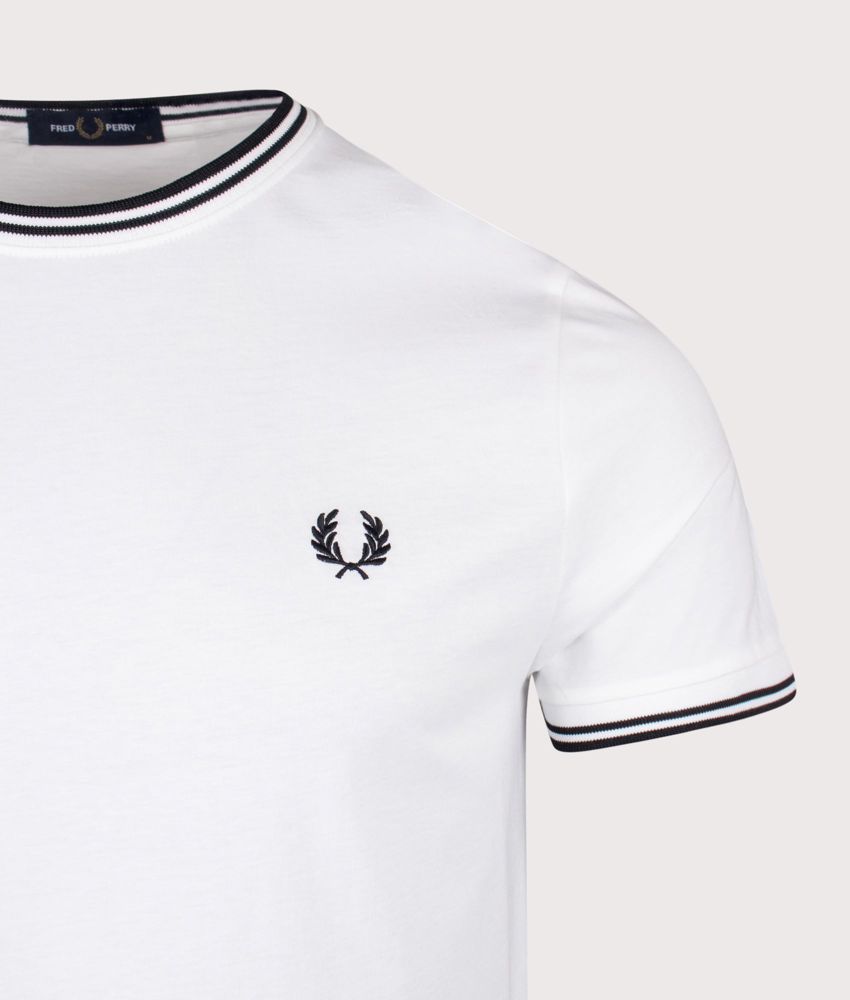 Fred Perry Twin Tipped T-Shirt in White at EQVVS Menswear. Detail shot.