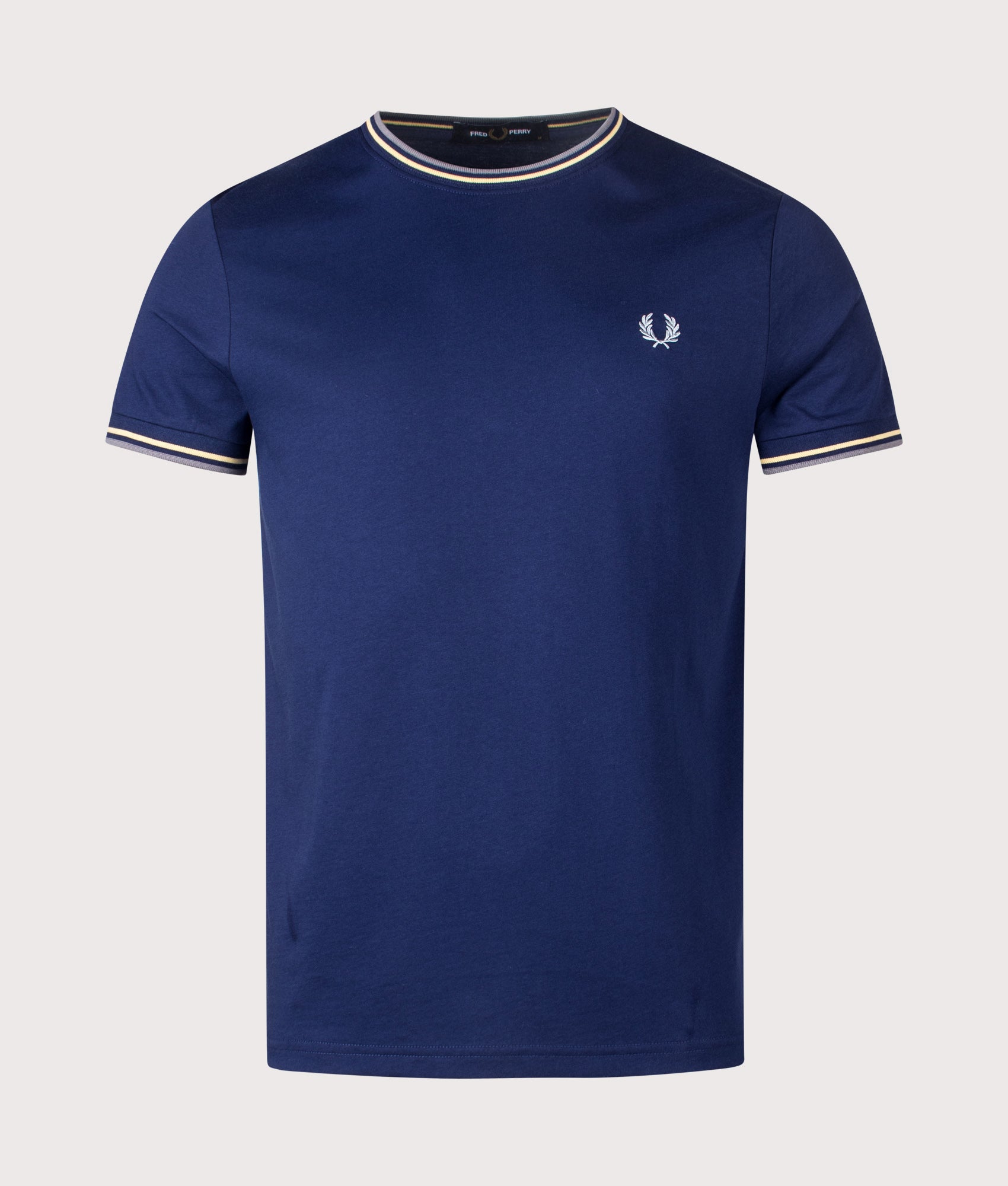 Fred Perry Twin Tipped T-Shirt in French Navy, Champions Gold and Stockport Blue at EQVVS Menswear. Front shot.