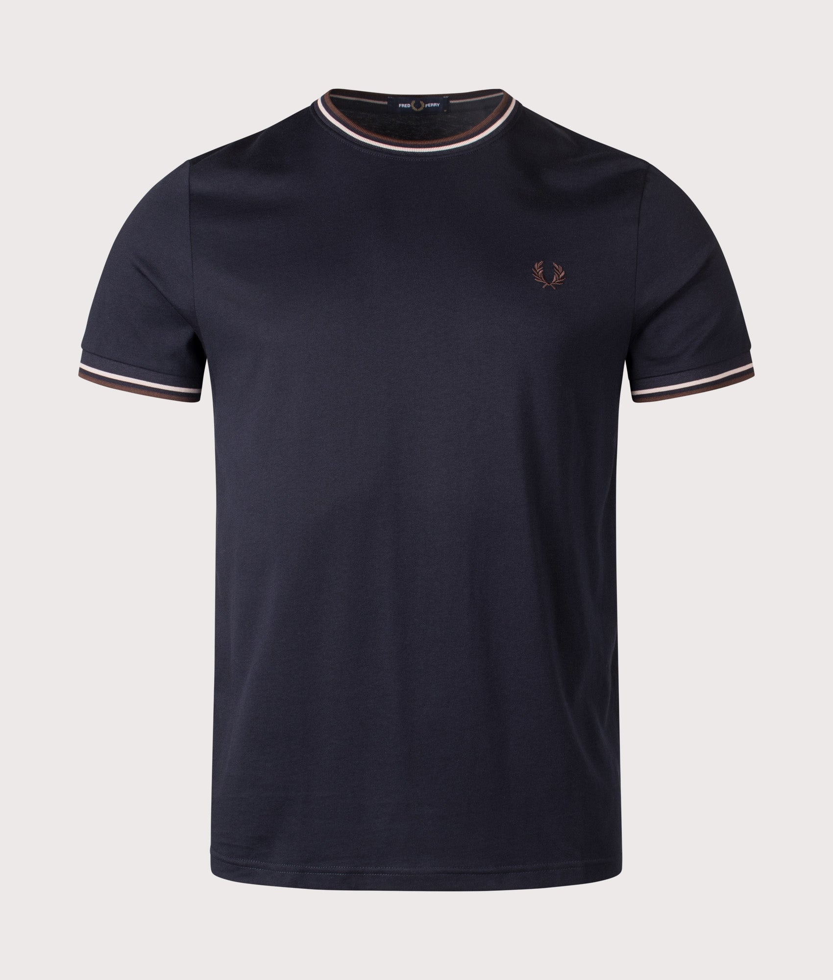 Fred Perry essential, the Twin Tipped T-Shirt in Navy, Warm Oat and Burnt Tobacco at EQVVS Menswear. Front shot. 