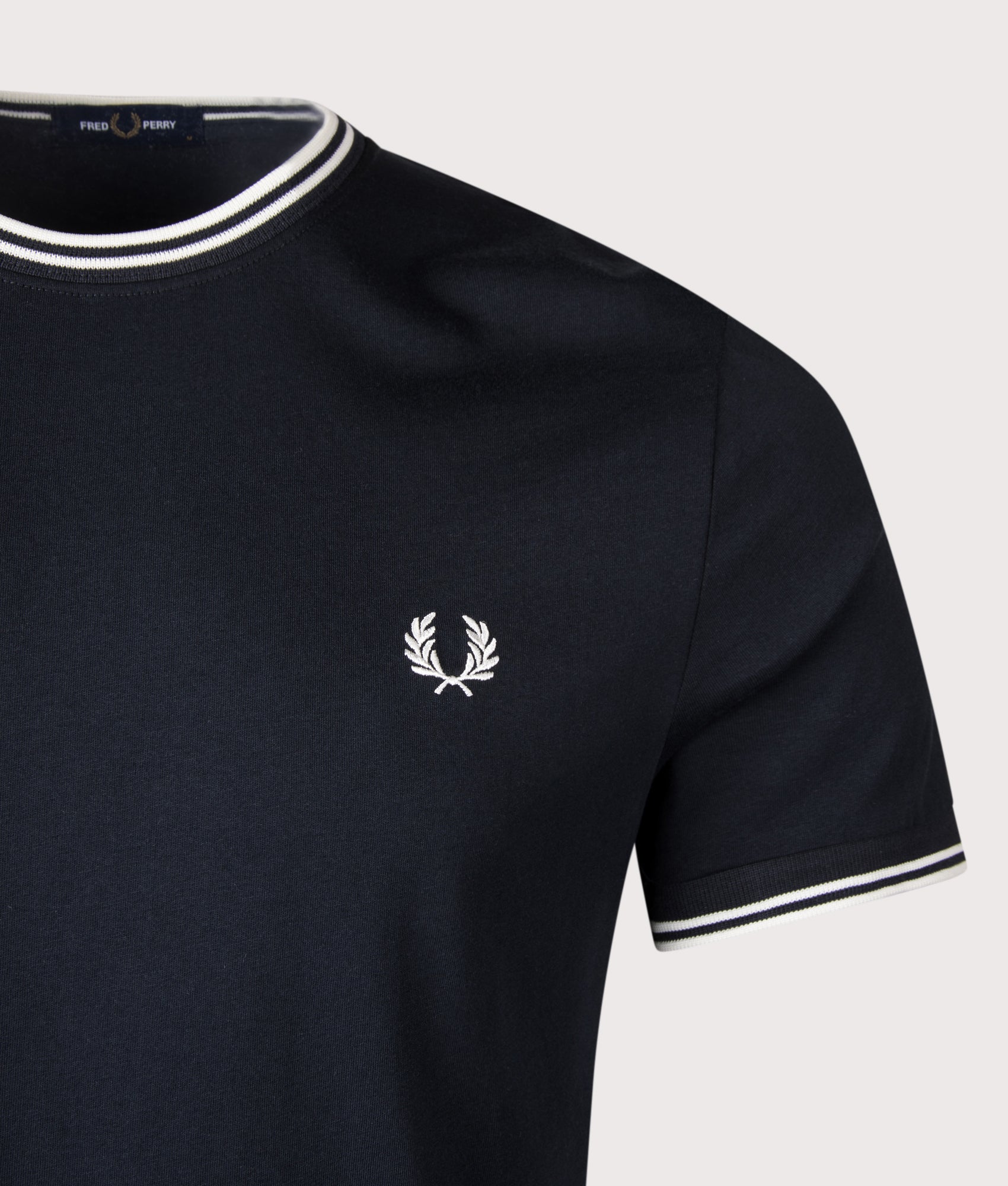 Twin Tipped T-Shirt in Navy by Fred Perry. Detail Shot. Shot by EQVVS.