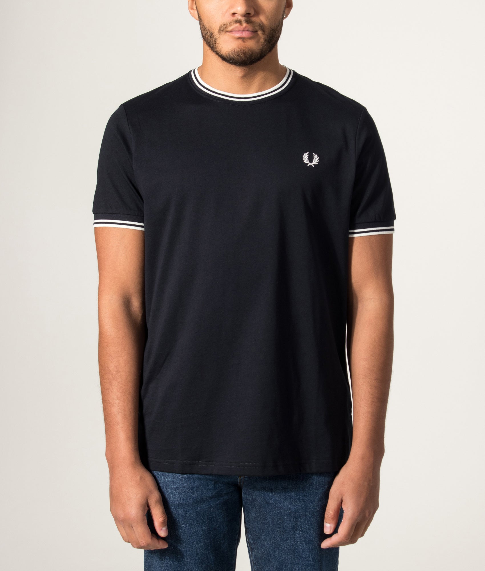 Fred Perry Twin Tipped T-Shirt in Navy at EQVVS Menswear. Model front shot.