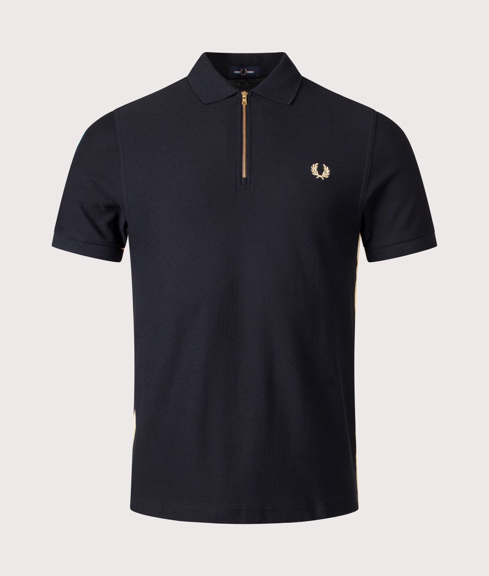 Fred Perry Stripe Tape Zip Neck Polo Shirt in Black and Champagne at EQVVS Menswear. Front shot.