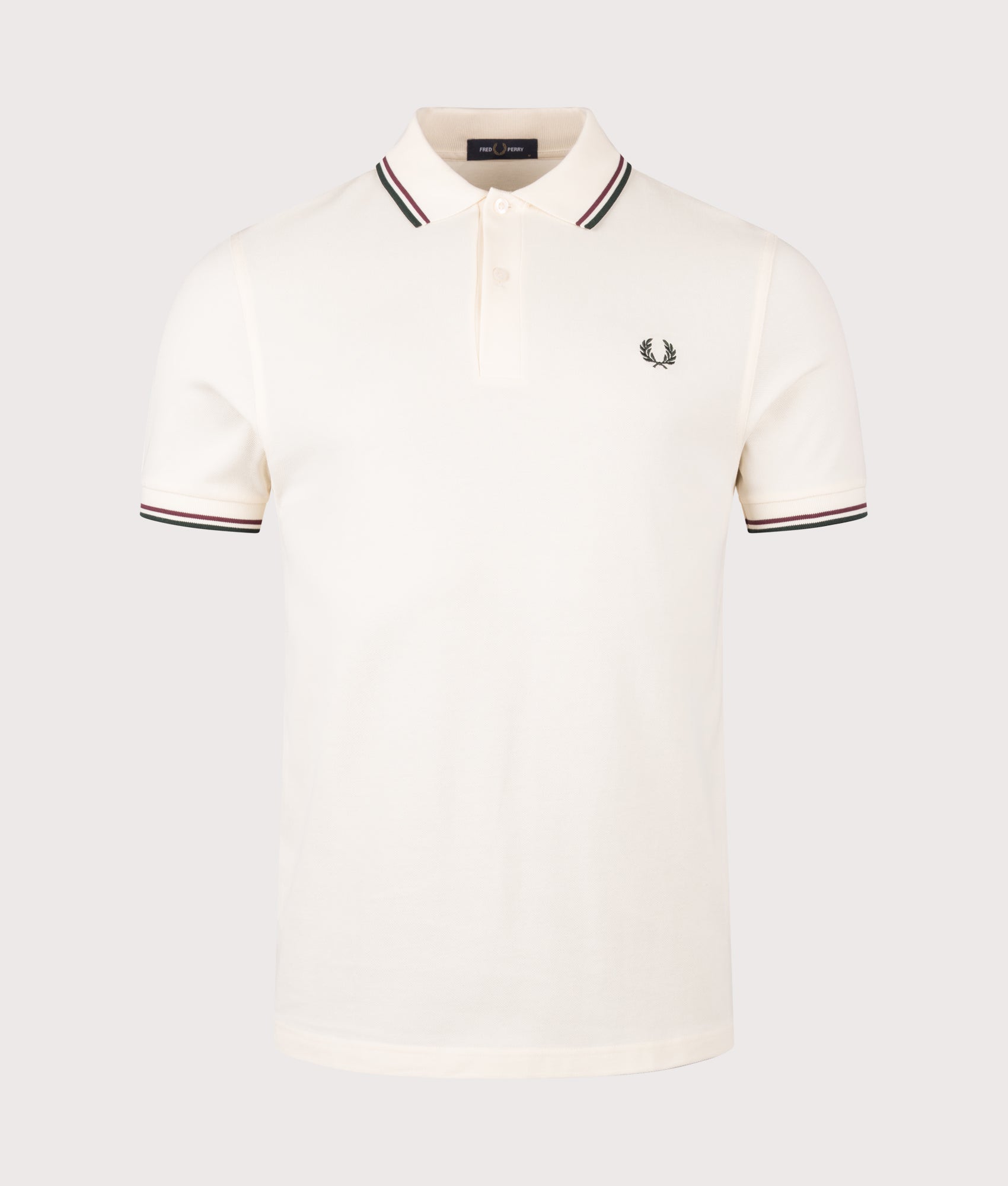 Fred Perry Twin Tipped Fred Perry Polo Shirt in Ecru, Oxblood and Grassroots at EQVVS Menswear. Front shot.