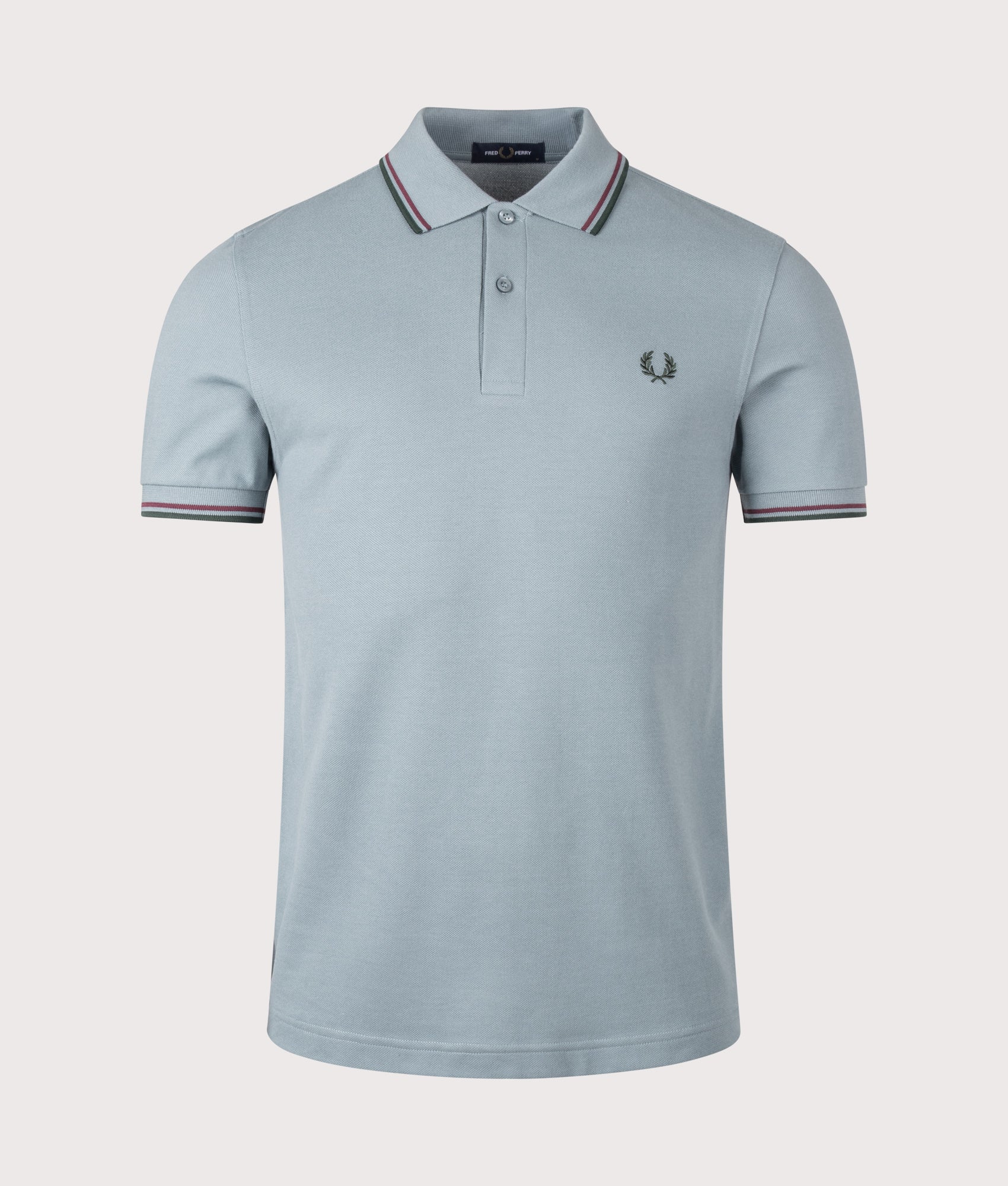 Fred Perry Twin Tipped Fred Perry Polo Shirt in Stockport Blue, Oxblood and Grassroots at EQVVS Menswear. Front shot.