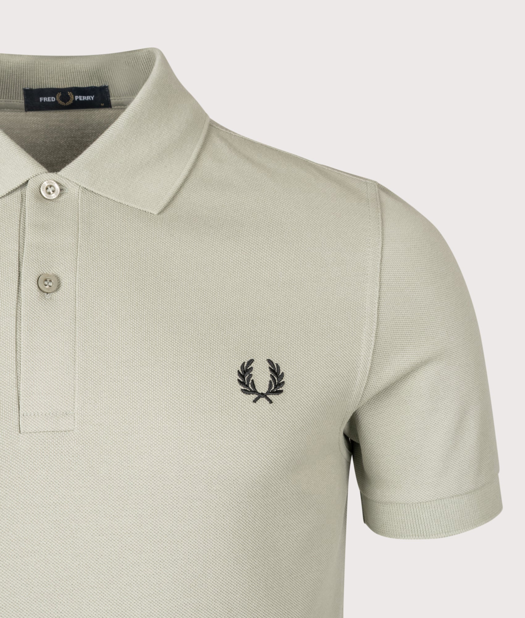 Fred Perry The Fred Perry Polo Shirt in Seagrass and Black at EQVVS Menswear. Detail shot.