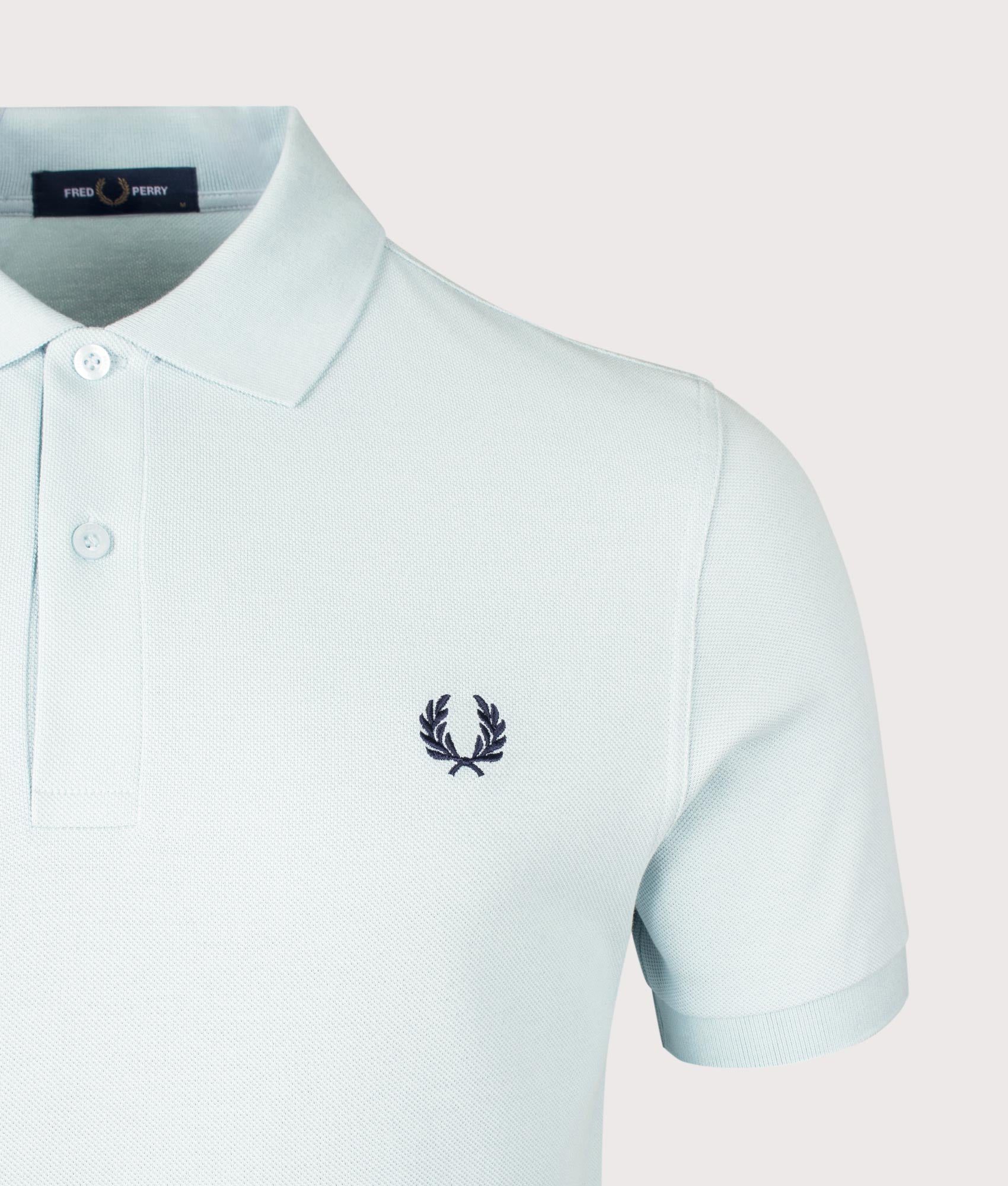 Fred Perry Fred Perry Polo Shirt Ball Boy Blue and Dark Air Force at EQVVS Menswear. Detail shot.