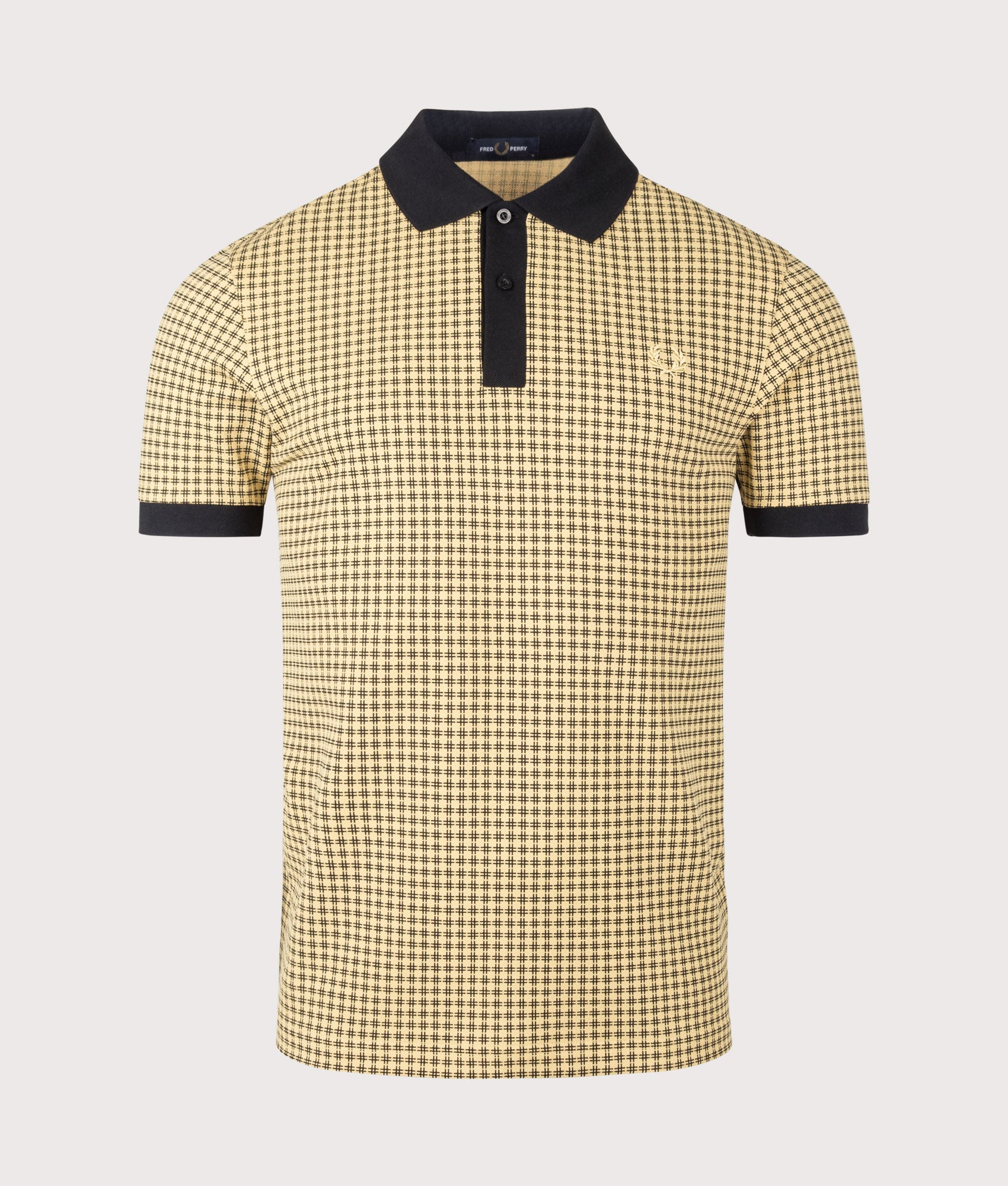 Fred Perry Cross Print Polo Shirt in Black at EQVVS Menswear. Front shot.