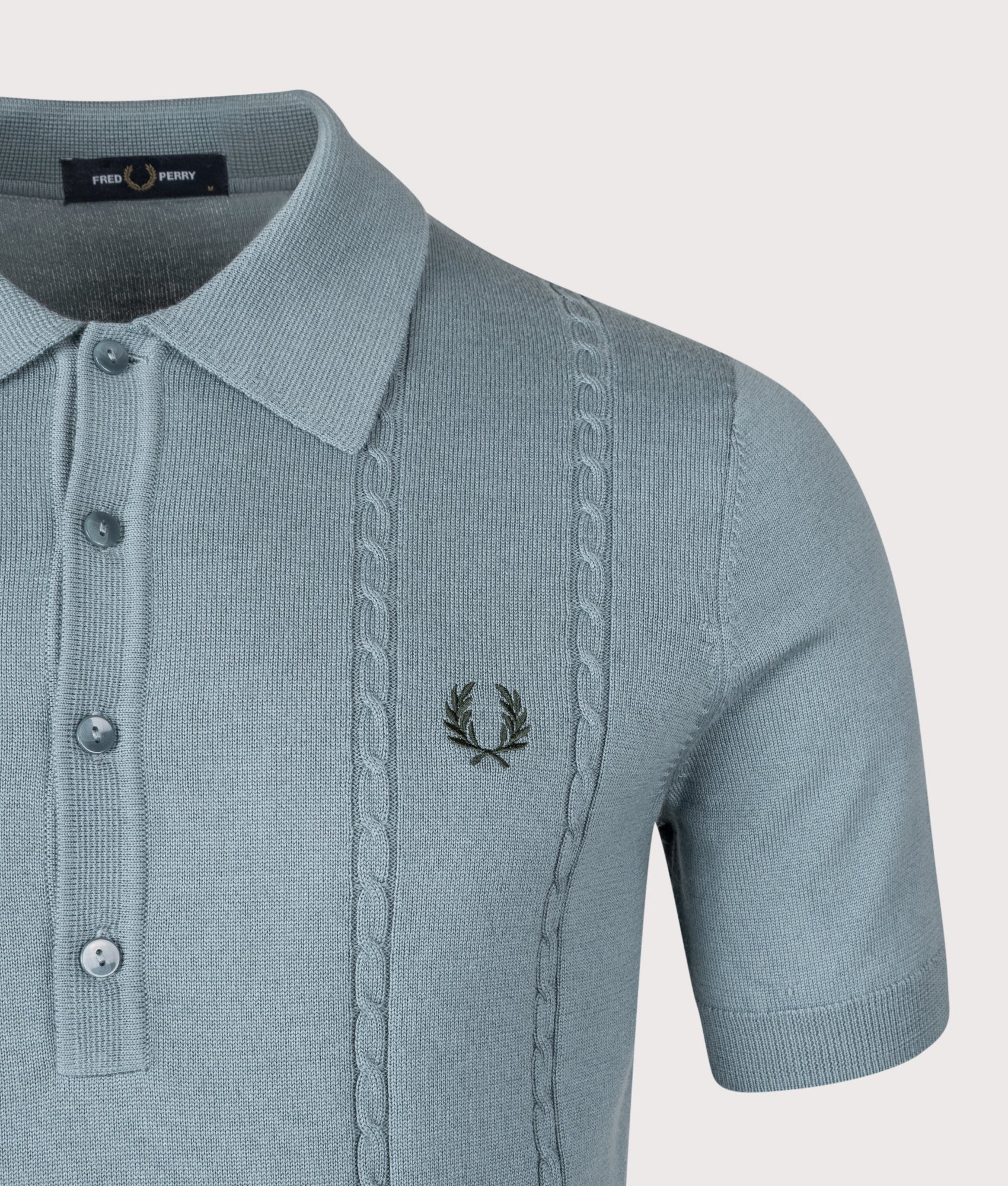 Fred Perry Cable Knitted Polo Shirt in Stockport Blue at EQVVS Menswear. Detail shot.