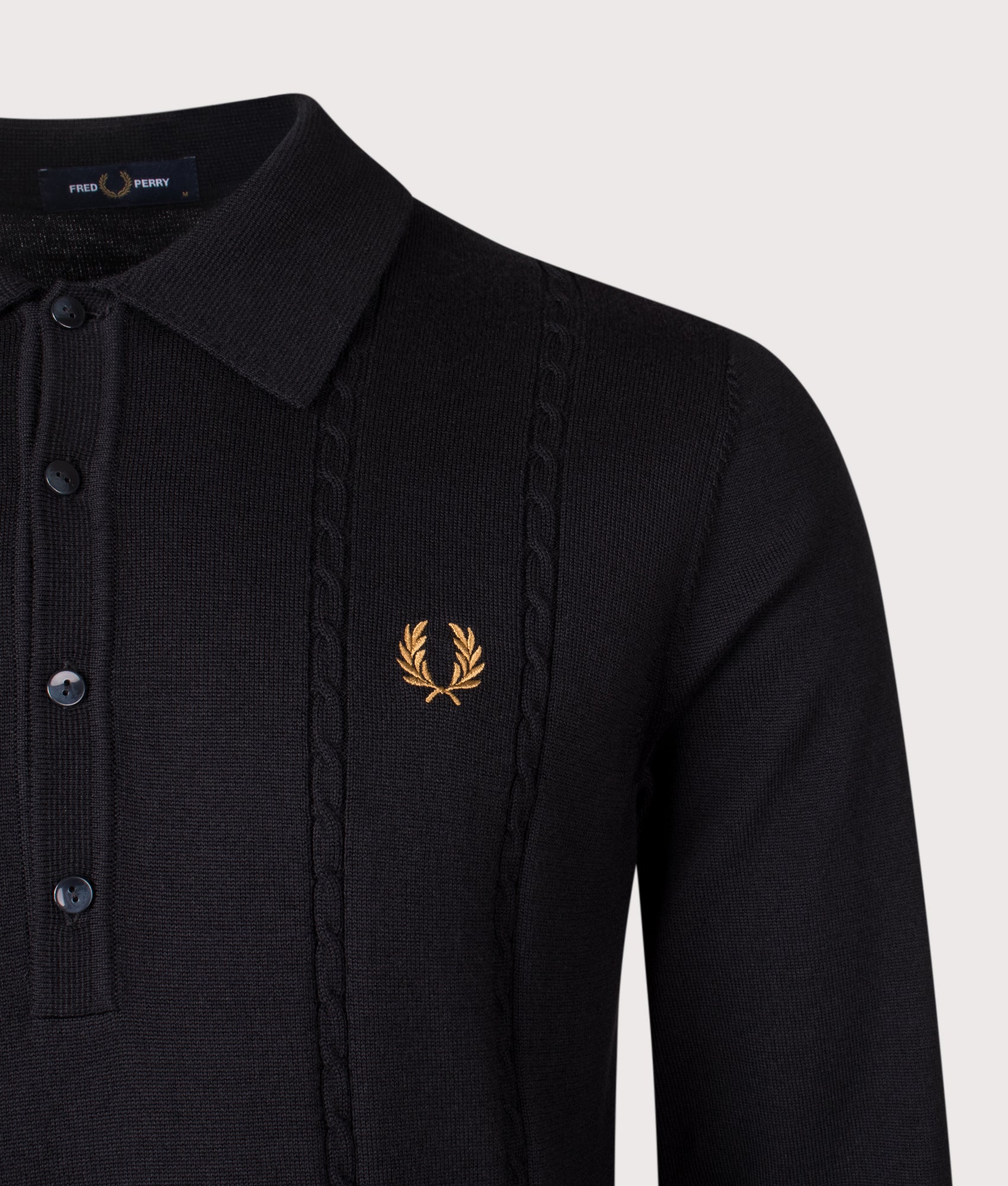 Fred Perry Long Sleeve Cable Knitted Polo Shirt in Black at EQVVS Menswear. Detail shot. 
