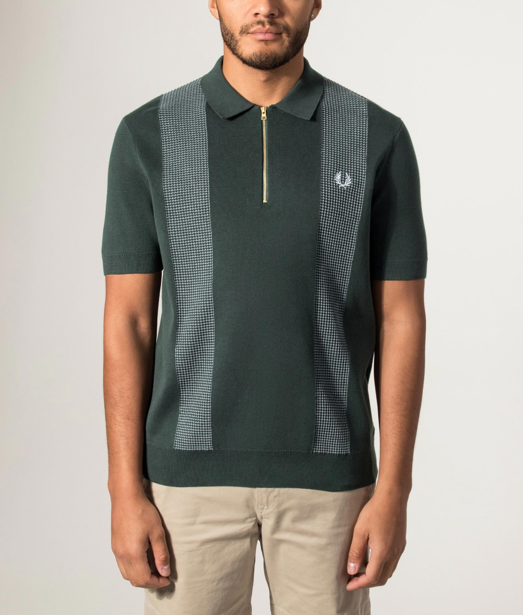 Fred Perry Panel Detail Knitted Polo Shirt in Grassroots at EQVVS Menswear. Model front shot.